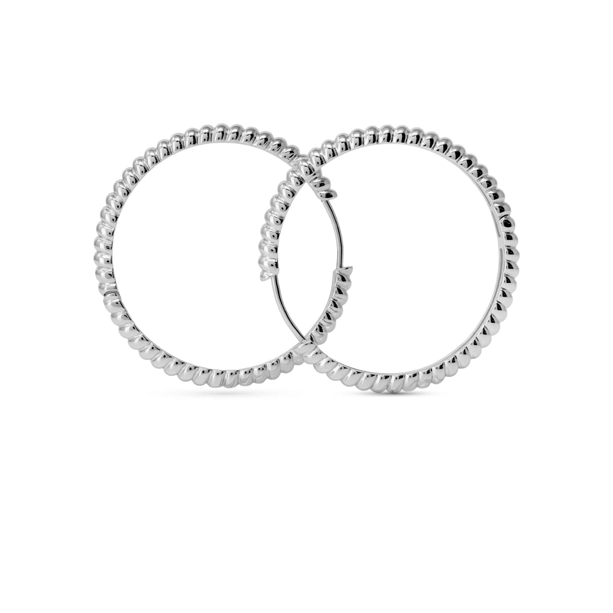Croissant Hoops earrings in 14k gold and rhodium-plated sterling silver.