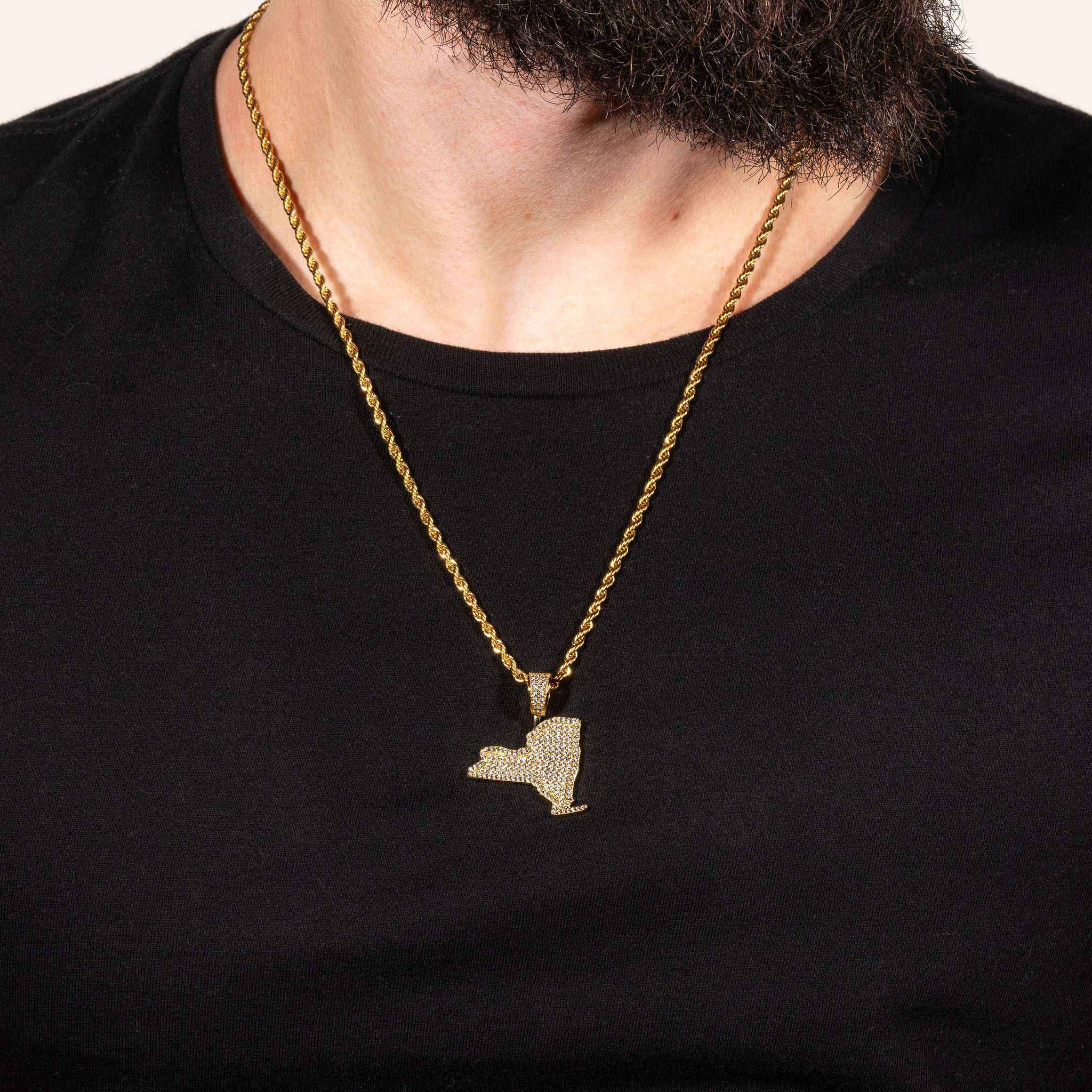 York Pendant made of solid 925 sterling silver with micro paved CZ diamonds, shown on a chain against a black background.