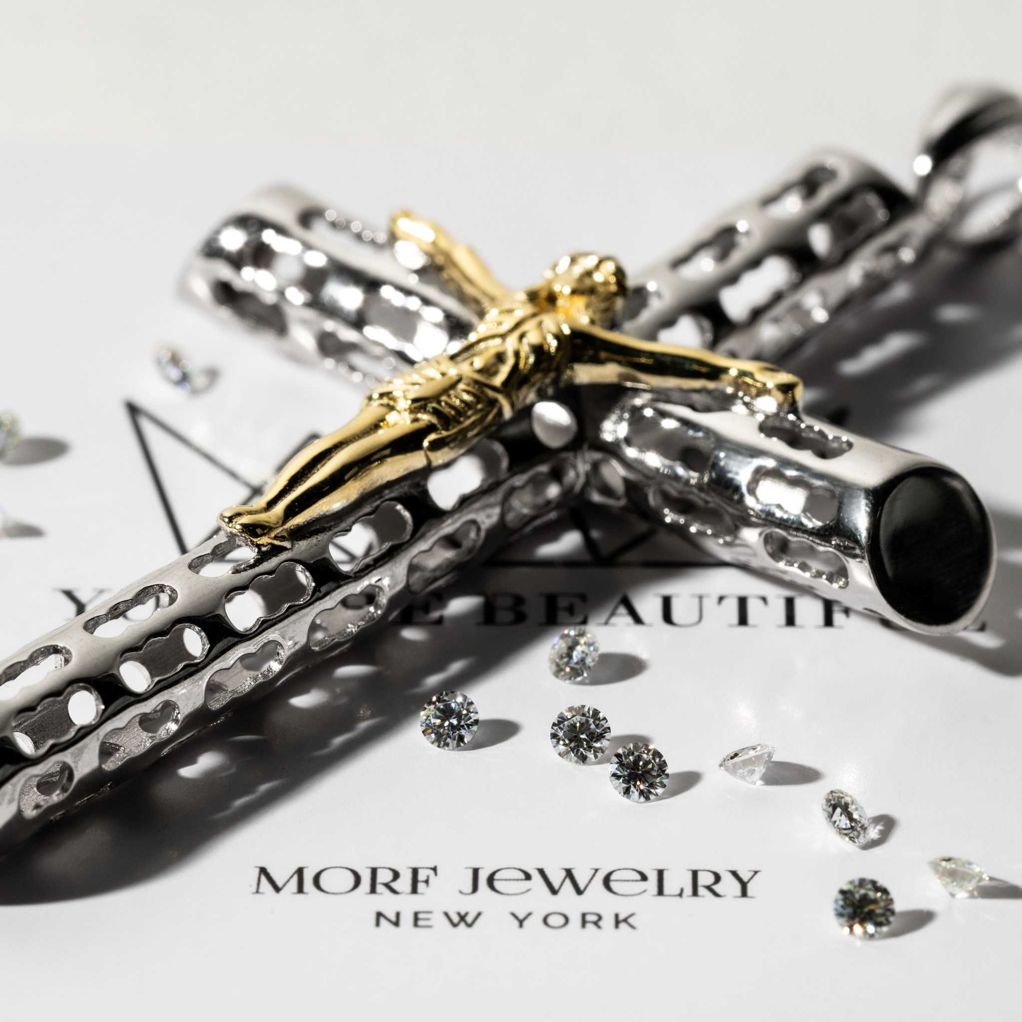 Two tone Jesus crucifix cross pendant in sterling silver and gold plating.