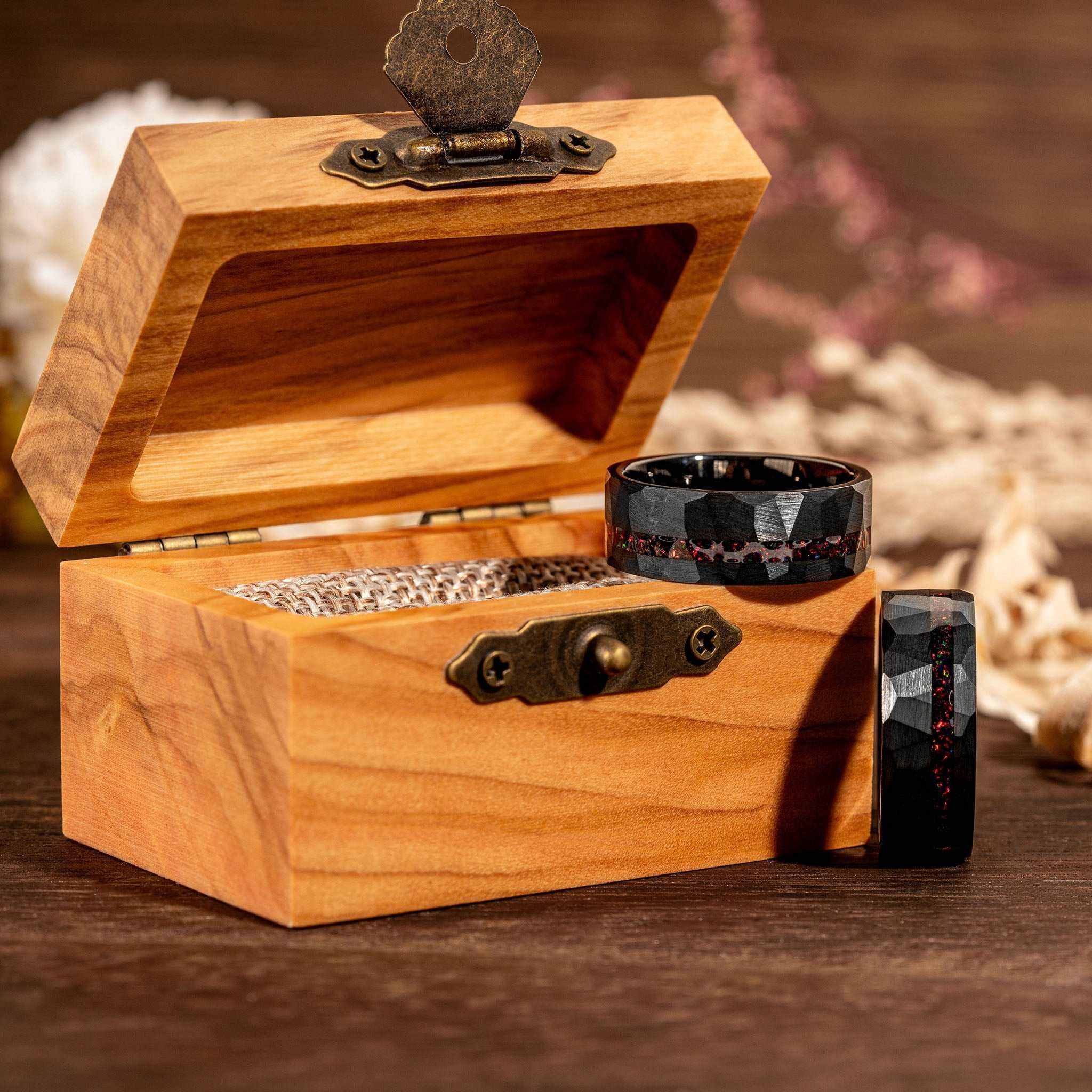 Black Tungsten Opal Ring with hammered texture and brushed finish in wooden box.