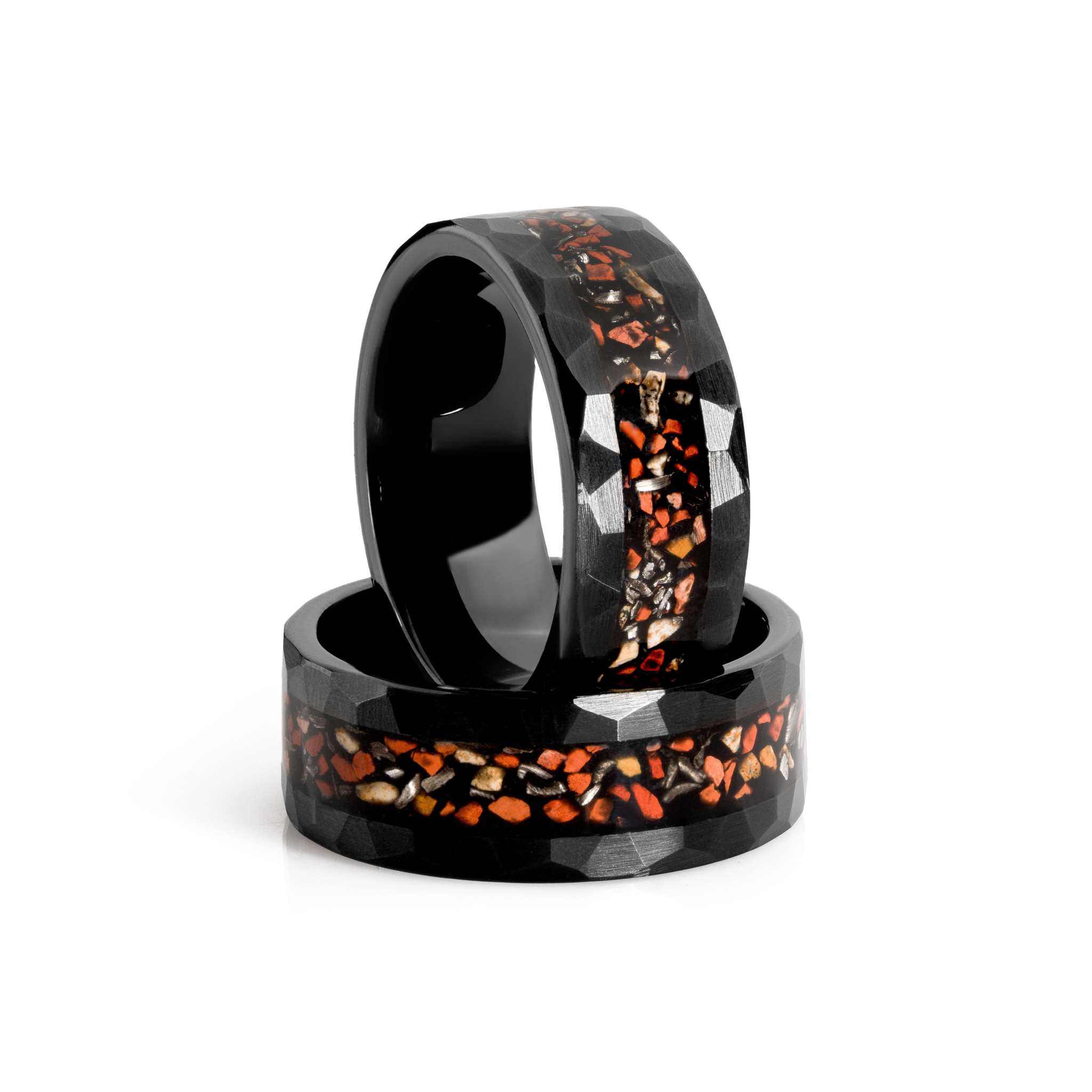 Black tungsten ring with genuine dinosaur bone and meteorite inlay, showcasing a unique prehistoric design and bold black plating.