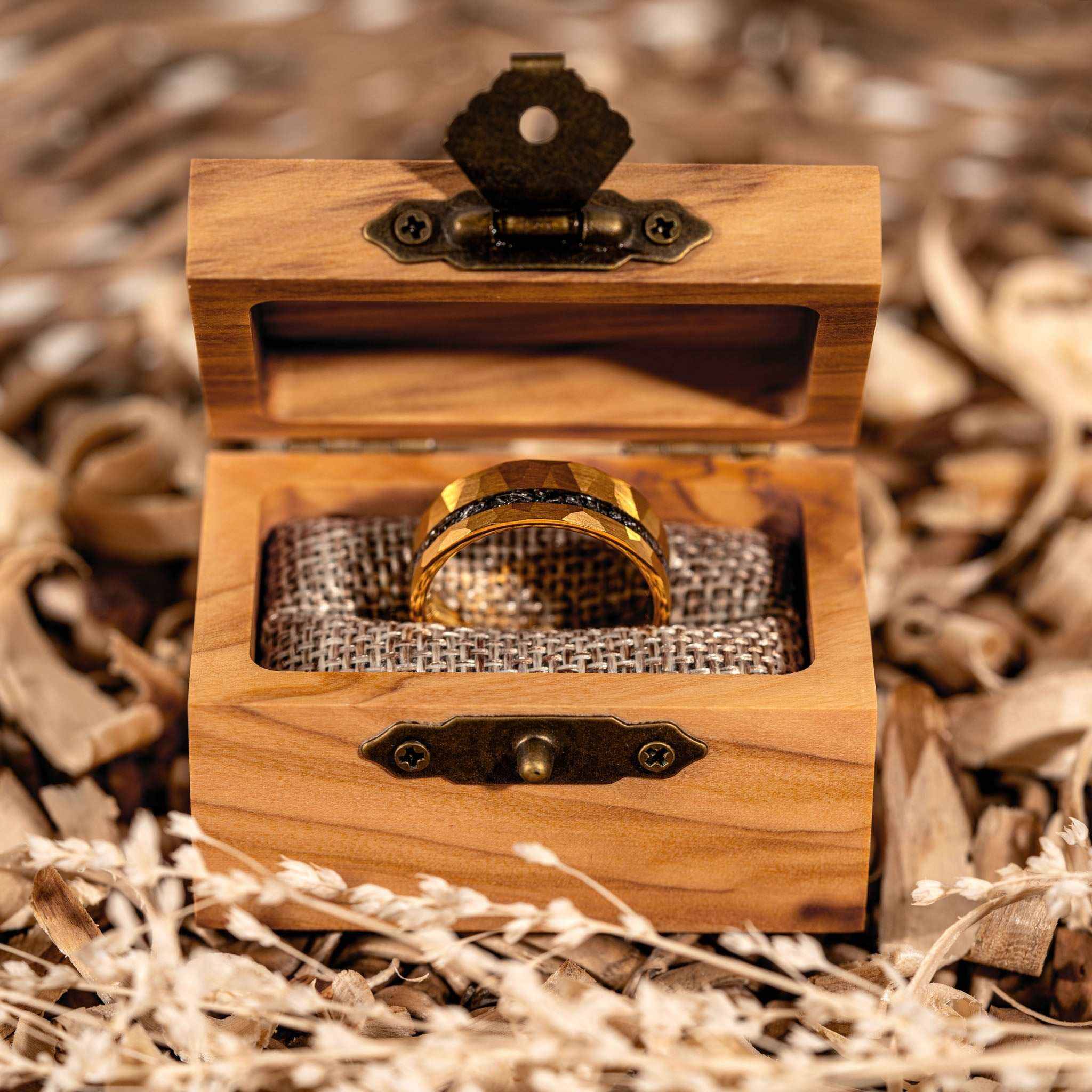 Handcrafted Infinite Meteorite Ring in walnut box featuring tungsten and gold with meteorite inlay.