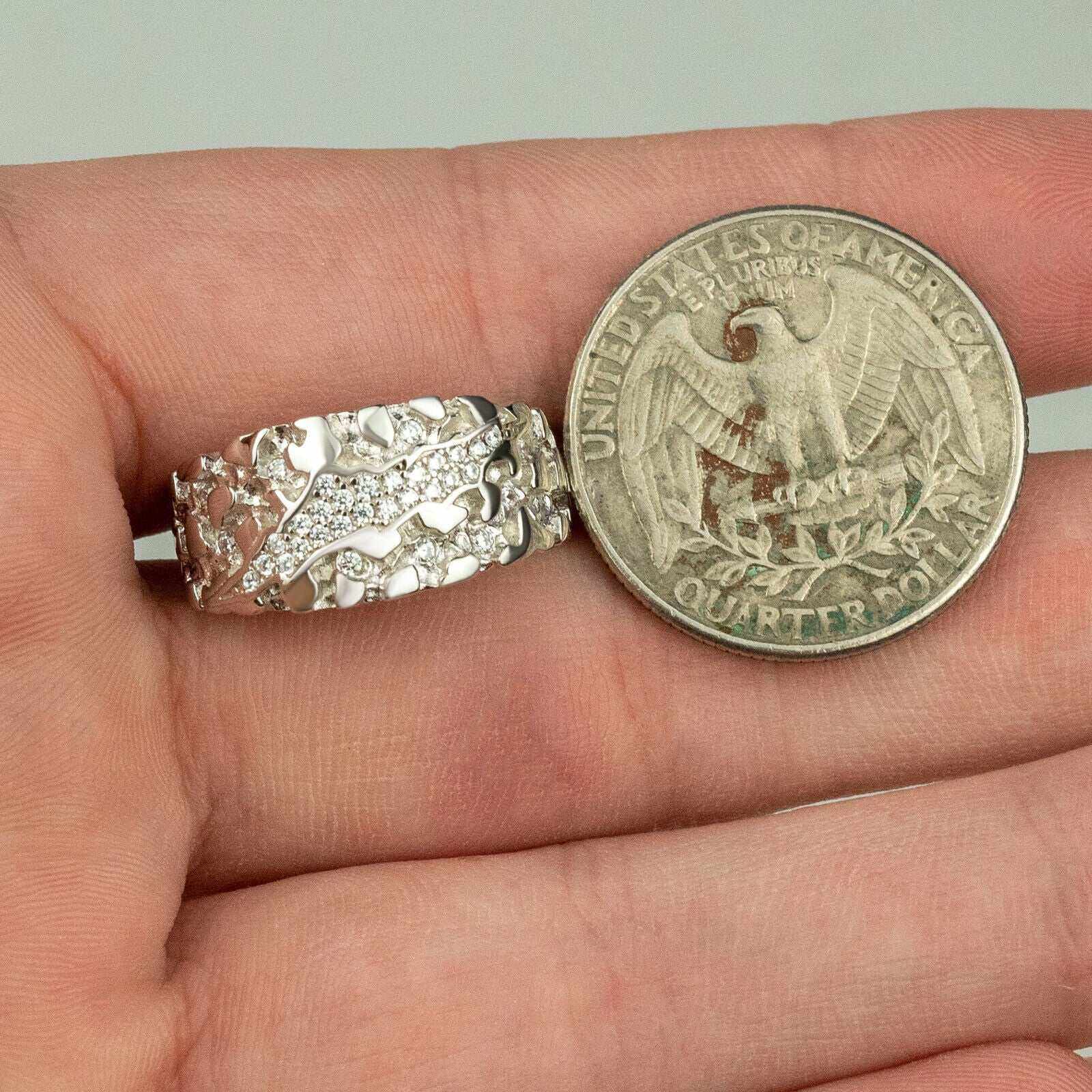 Nugget Claw Mark Ring in 925 Sterling Silver next to a quarter for size comparison.