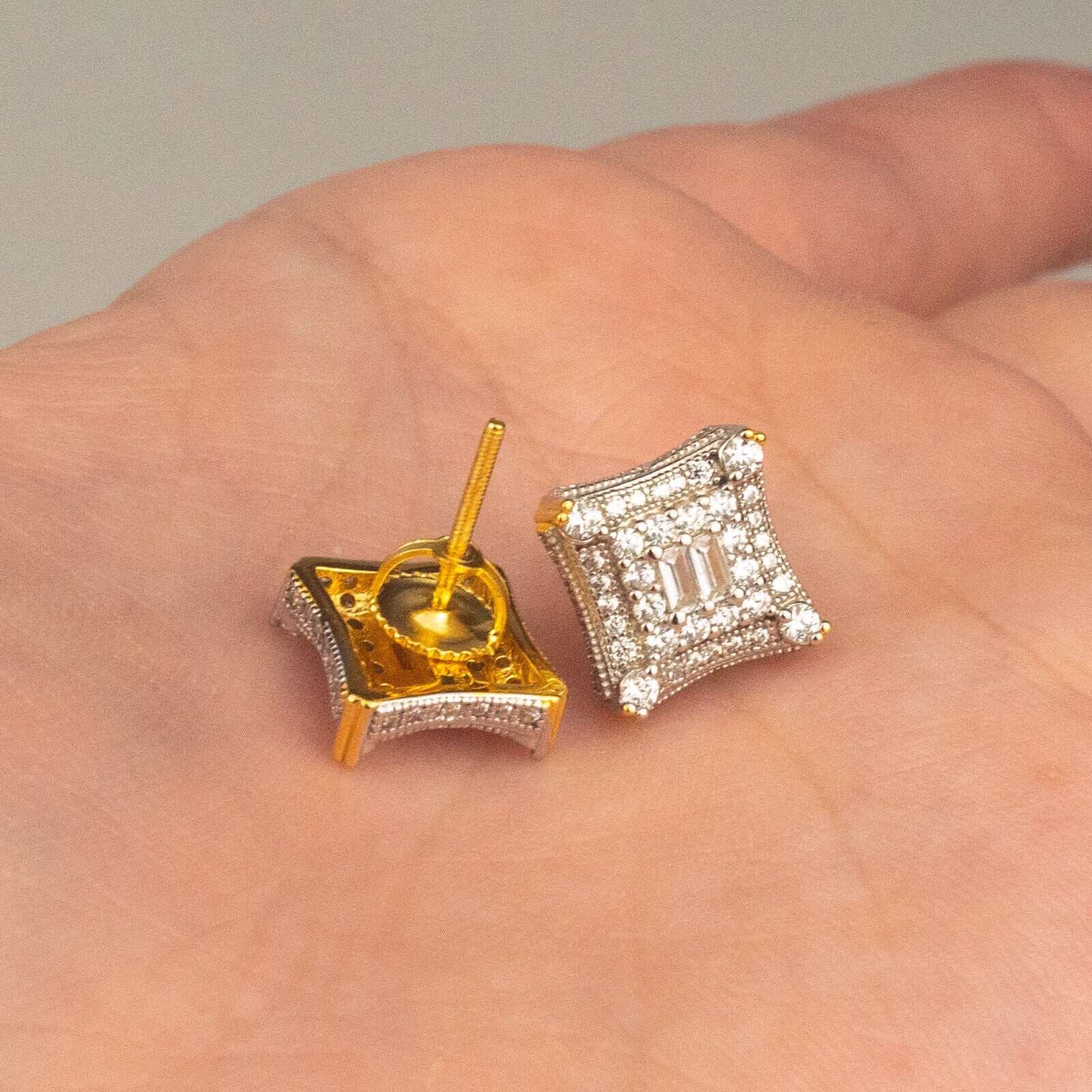 Mens solid 925 sterling silver 14K gold finish kite style earrings with CZ, showcased on palm.
