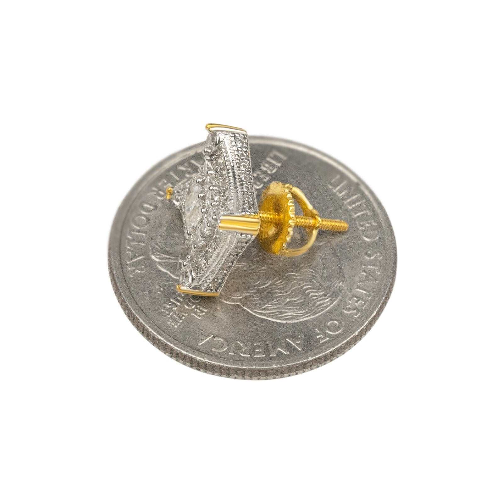Mens 925 sterling silver 14K gold finish CZ hip hop stud earrings placed on a coin for size reference.