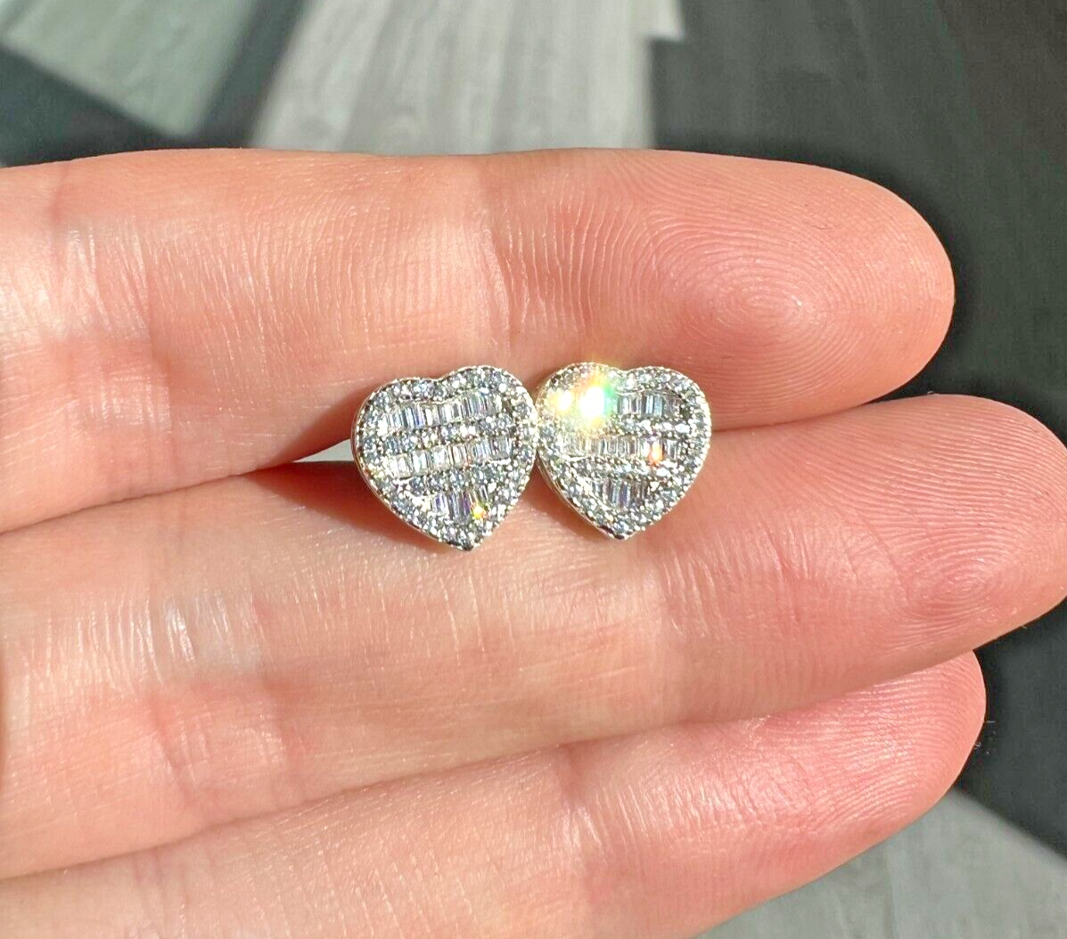 Baguette heart shaped earrings with simulated diamonds in 925 sterling silver plated with 14k gold.