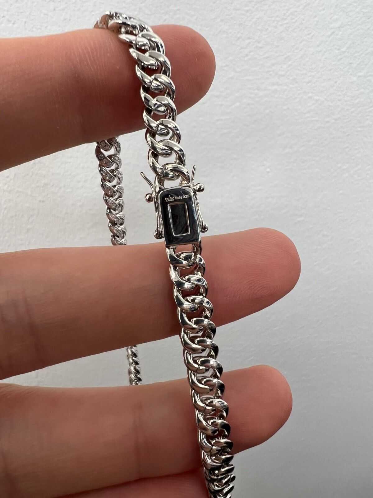 Mens real moissanite iced Cuban link chain in solid 925 sterling silver.