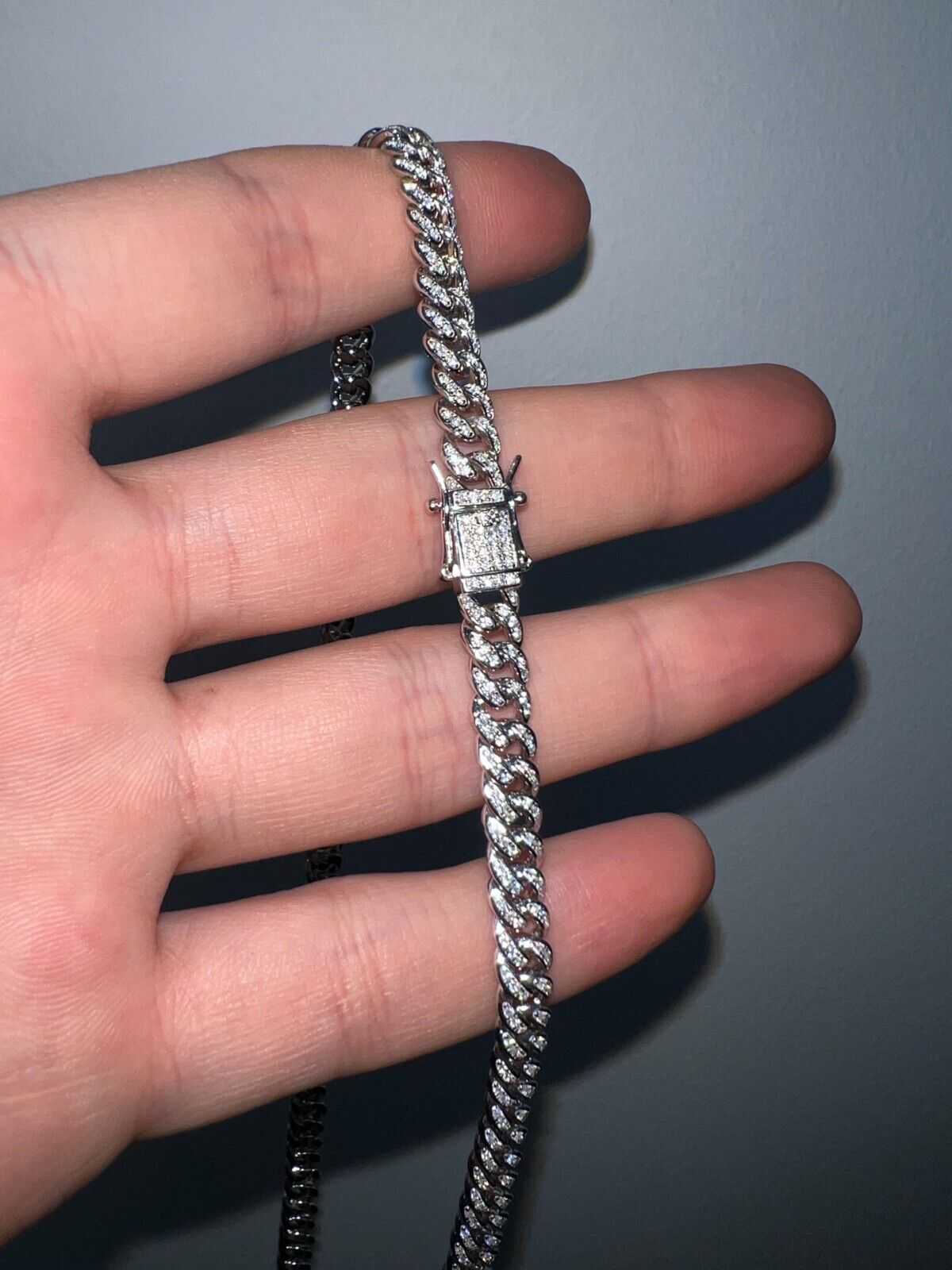 Mens real moissanite iced Cuban link chain in solid 925 sterling silver, hip hop style.