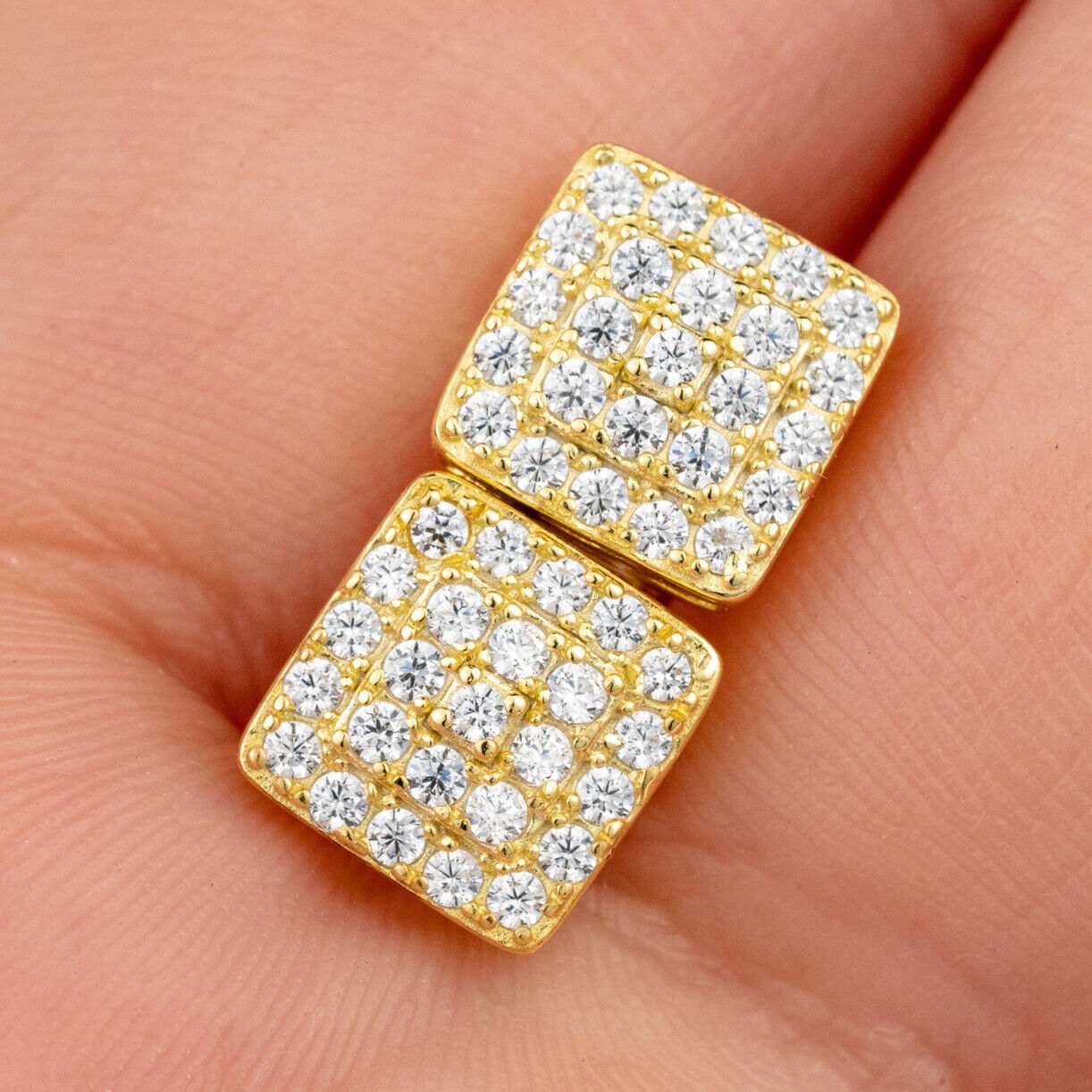 Square shaped stud earrings in 14K yellow gold plating with cubic zirconia stones.