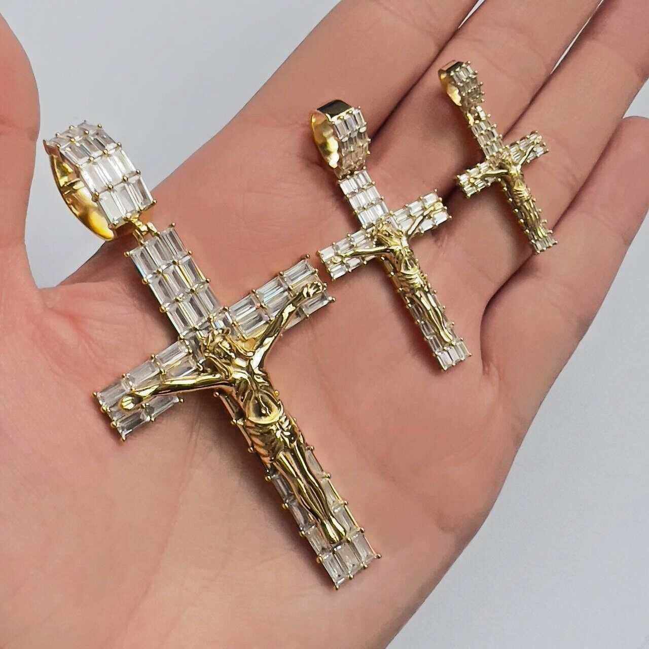 14K gold finish Jesus crucifix pendant with cubic zirconia, available in small, medium, and large sizes.