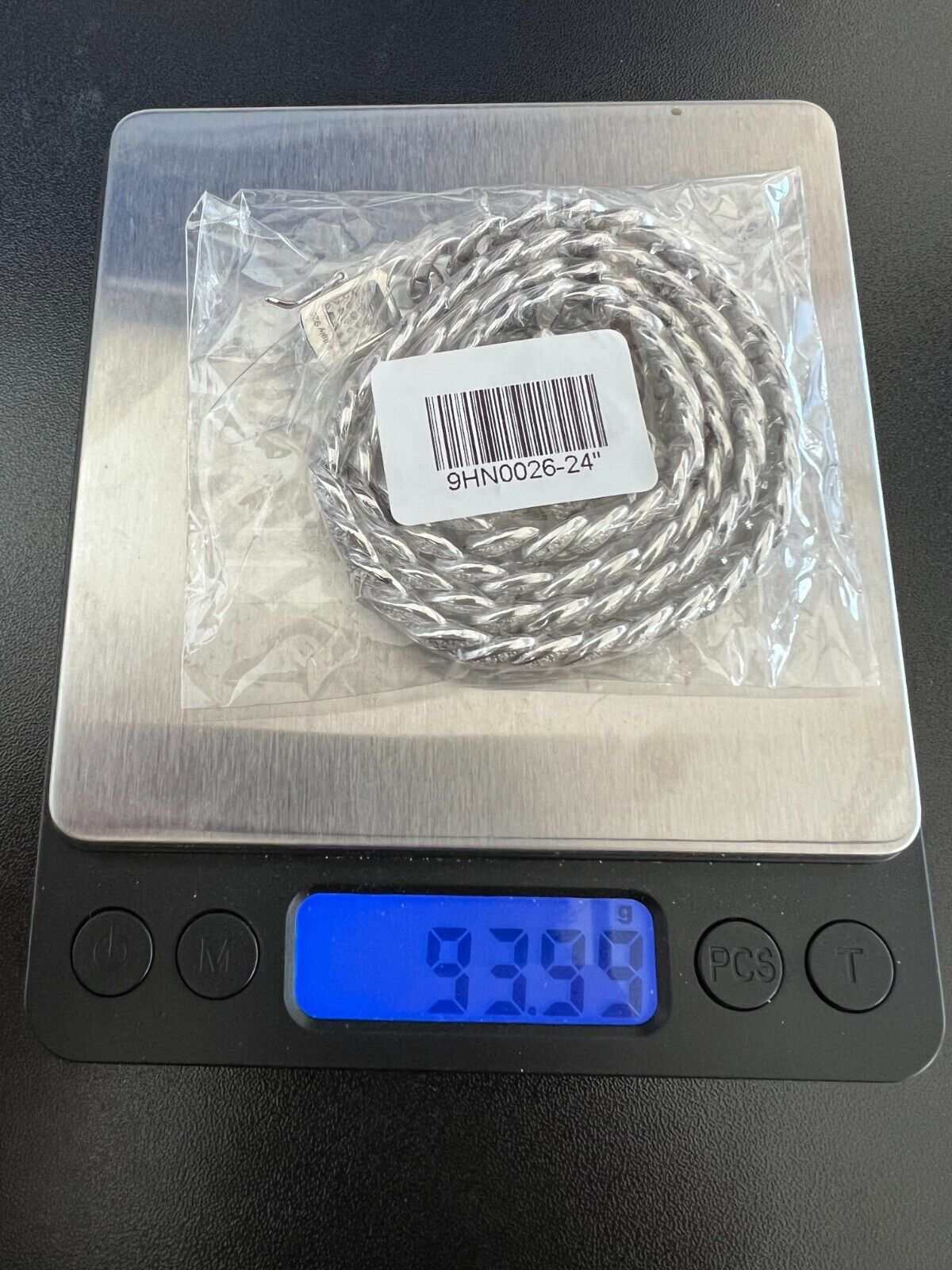 9MM Moissanite Real Miami Cuban Chain on digital scale displaying weight.