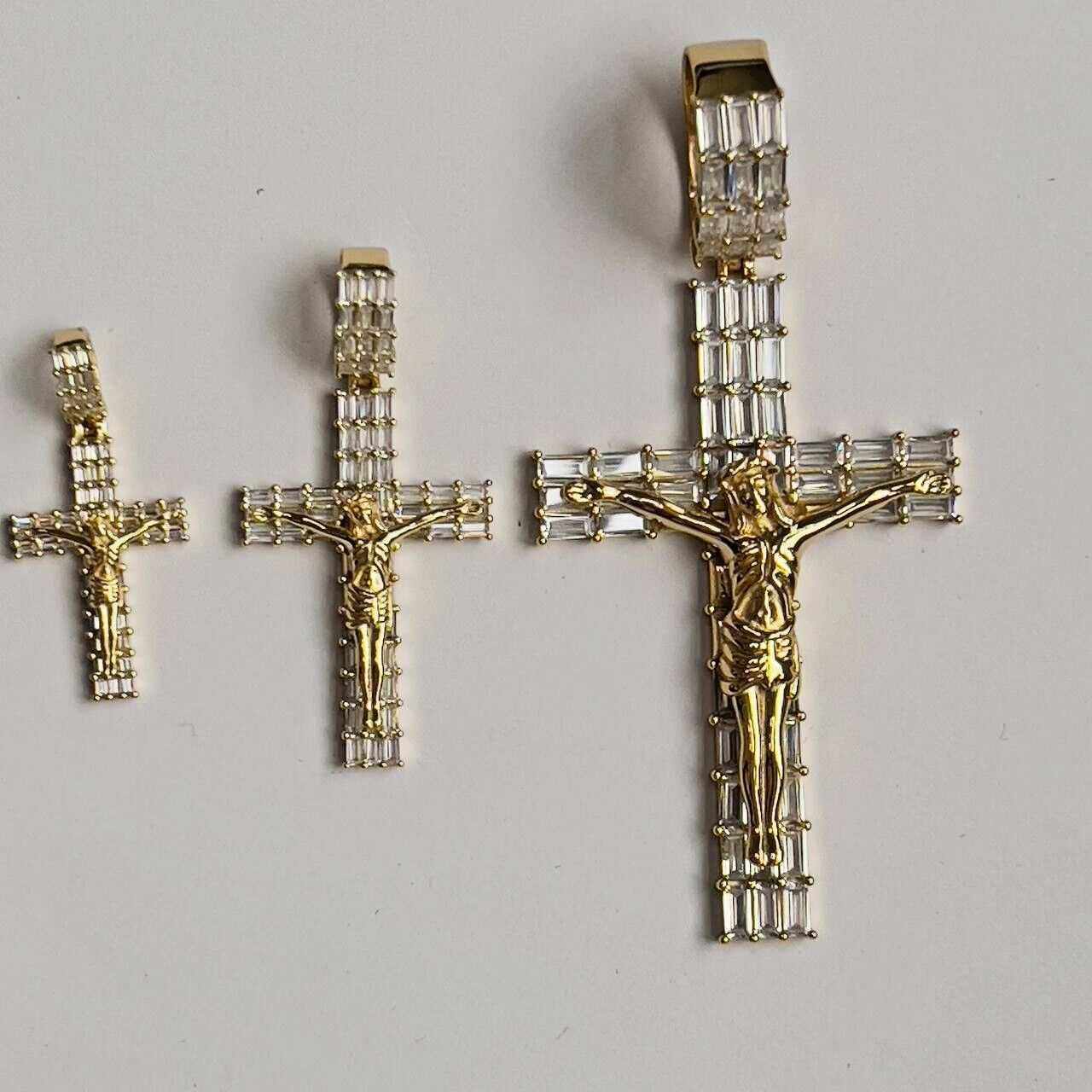 14K Gold Finish Jesus Crucifix Pendant with Clear CZ, available in three sizes.