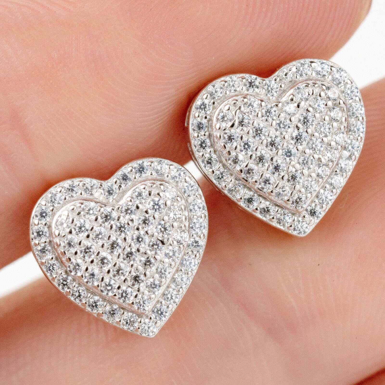 Heart shaped stud earrings in solid 925 sterling silver with VVS clear CZ stones.
