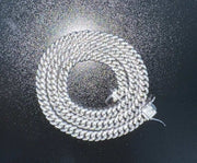 Mens real moissanite iced Cuban link chain, solid 925 sterling silver, hip hop style.