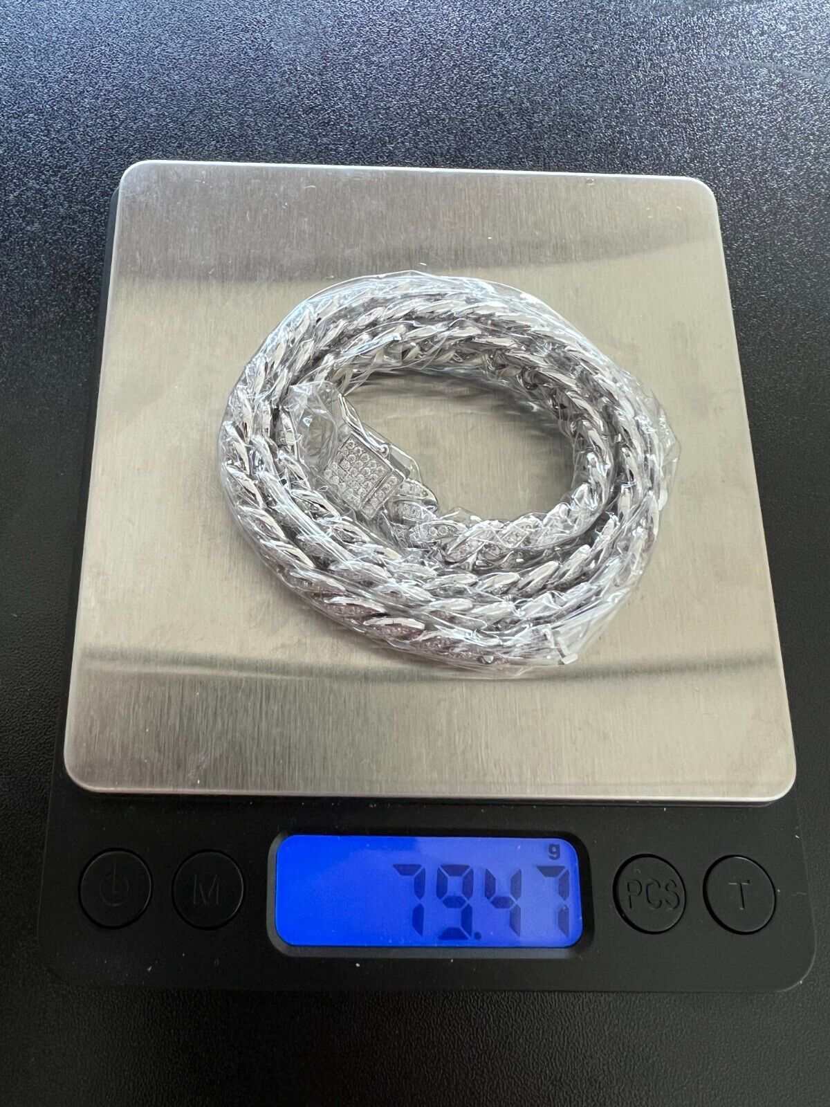 9MM Moissanite Real Miami Cuban Chain on digital scale, weighing 79.4 grams.