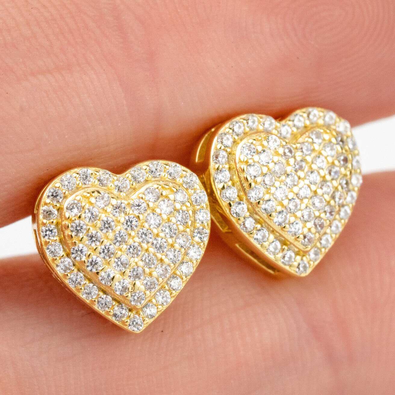 Men's heart-shaped hip hop studs in 925 sterling silver and 14k gold.