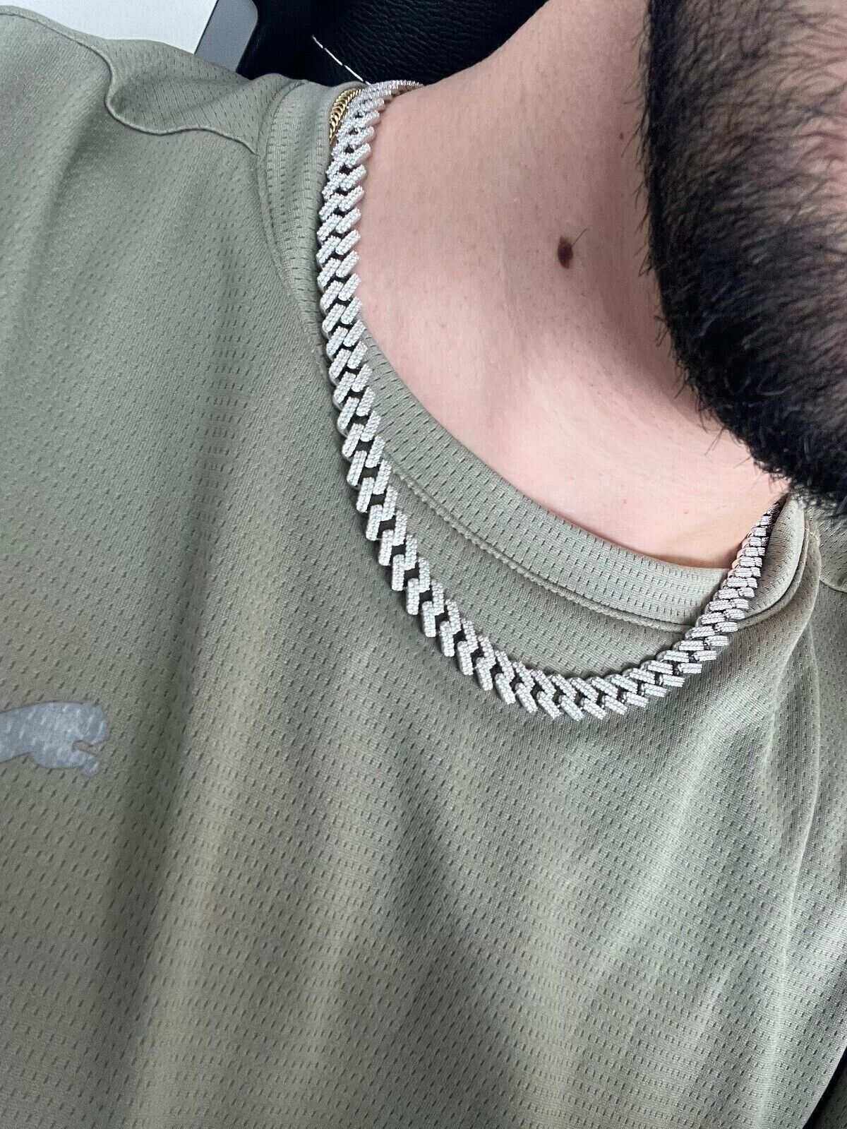 10mm Moissanite Miami Cuban Chain in 925 Sterling Silver with Rhodium Finish, worn on neck.
