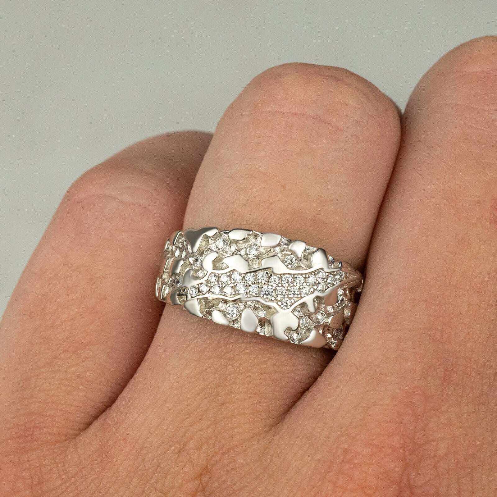Nugget Claw Mark Ring in 925 Sterling Silver with CZ stones, worn on a finger.