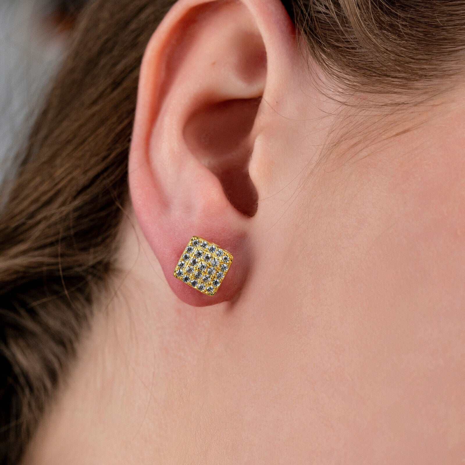Square shaped stud earrings with cubic zirconia stones and 14K yellow gold plating.