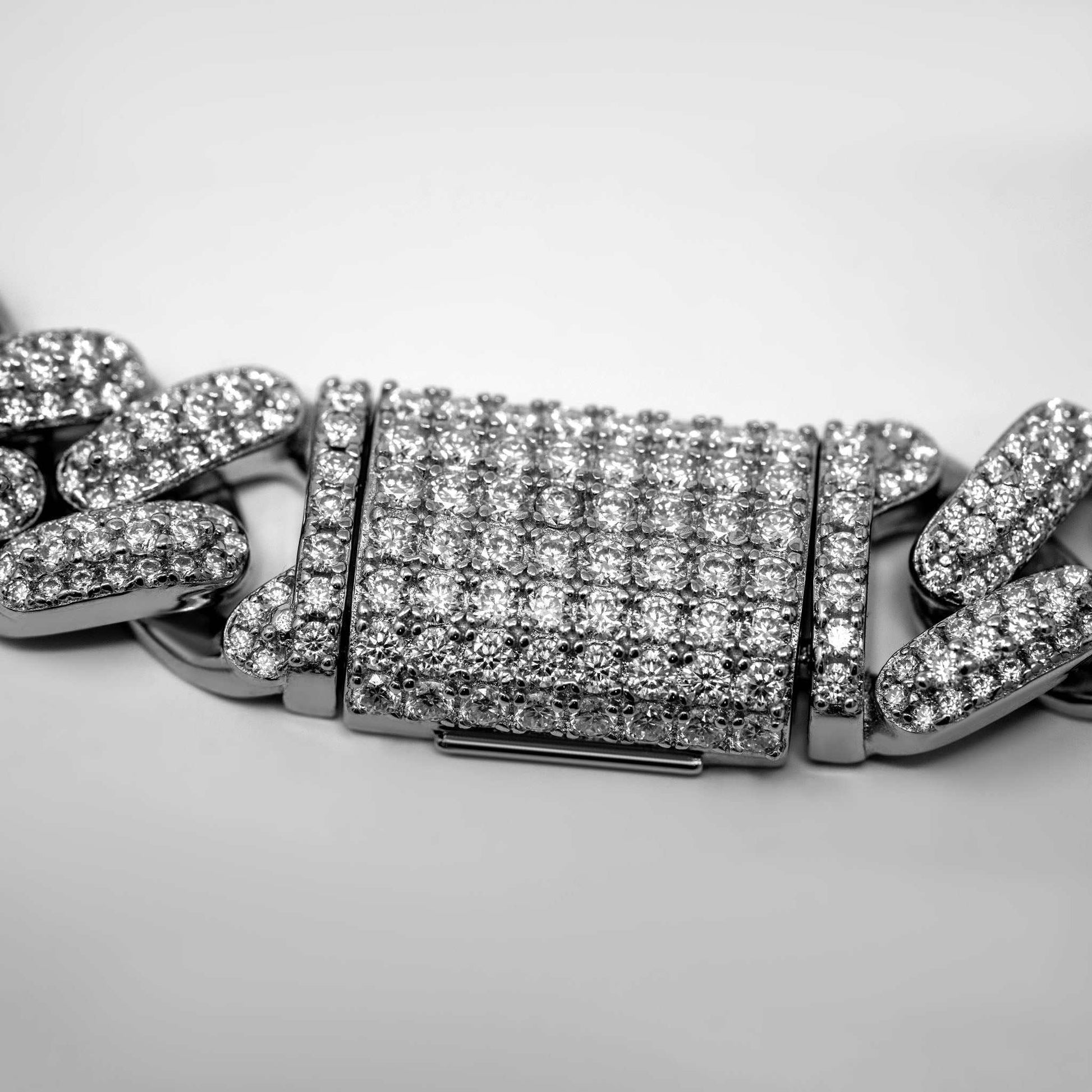 12mm Moissanite Miami Cuban Link Chain in sterling silver with moissanite stones.