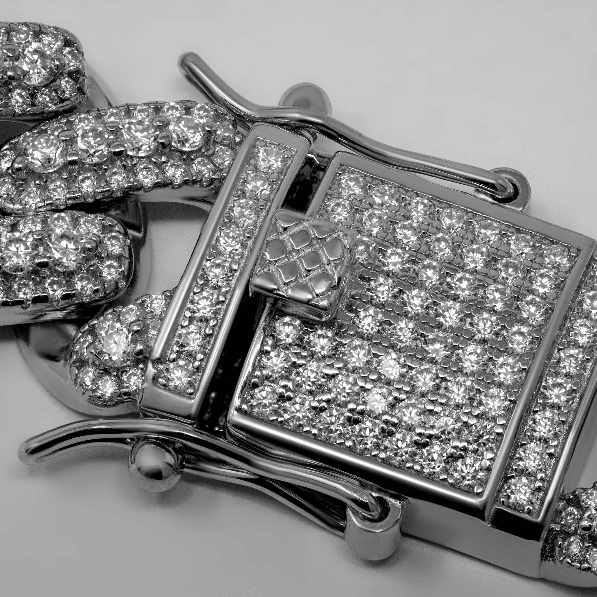 13mm men's moissanite Miami Cuban link chain clasp detail with sparkling stones.