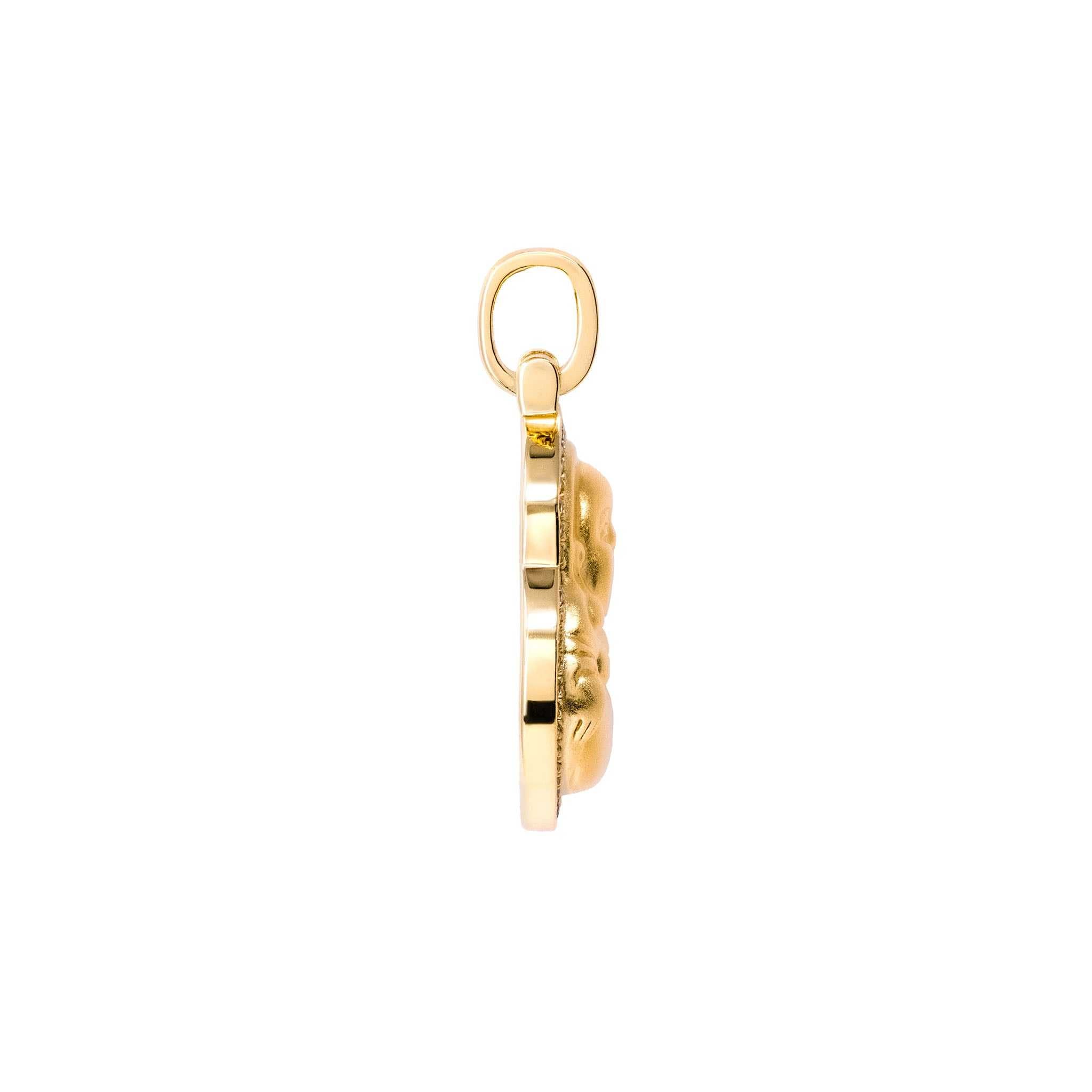Side view of gold Buddha pendant, showcasing its intricate three-dimensional design and elegant finish.