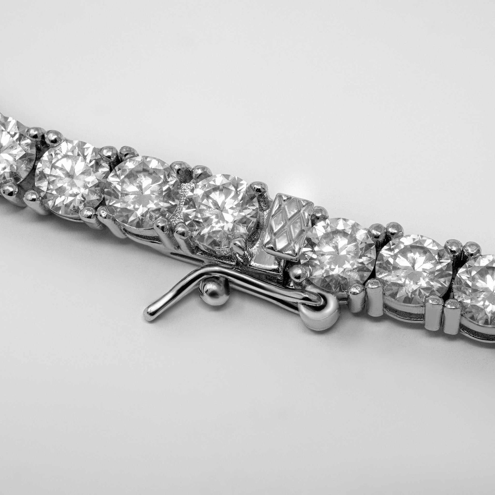 4mm Moissanite Tennis Chain with 37.49ct stones, sterling silver, rhodium finish, 20 inches long.
