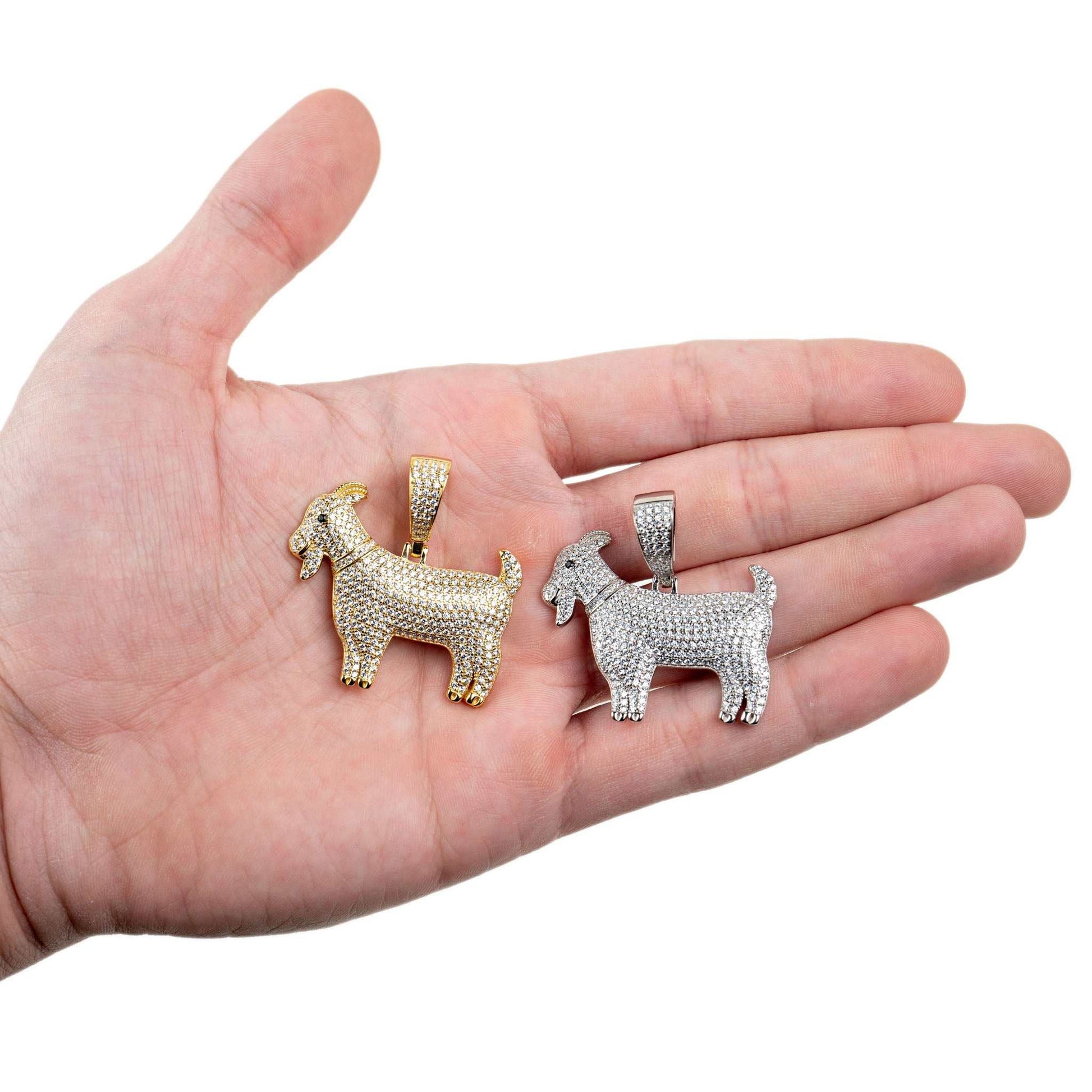 GOAT Pendant in rhodium-plated silver and 14K gold on hand.