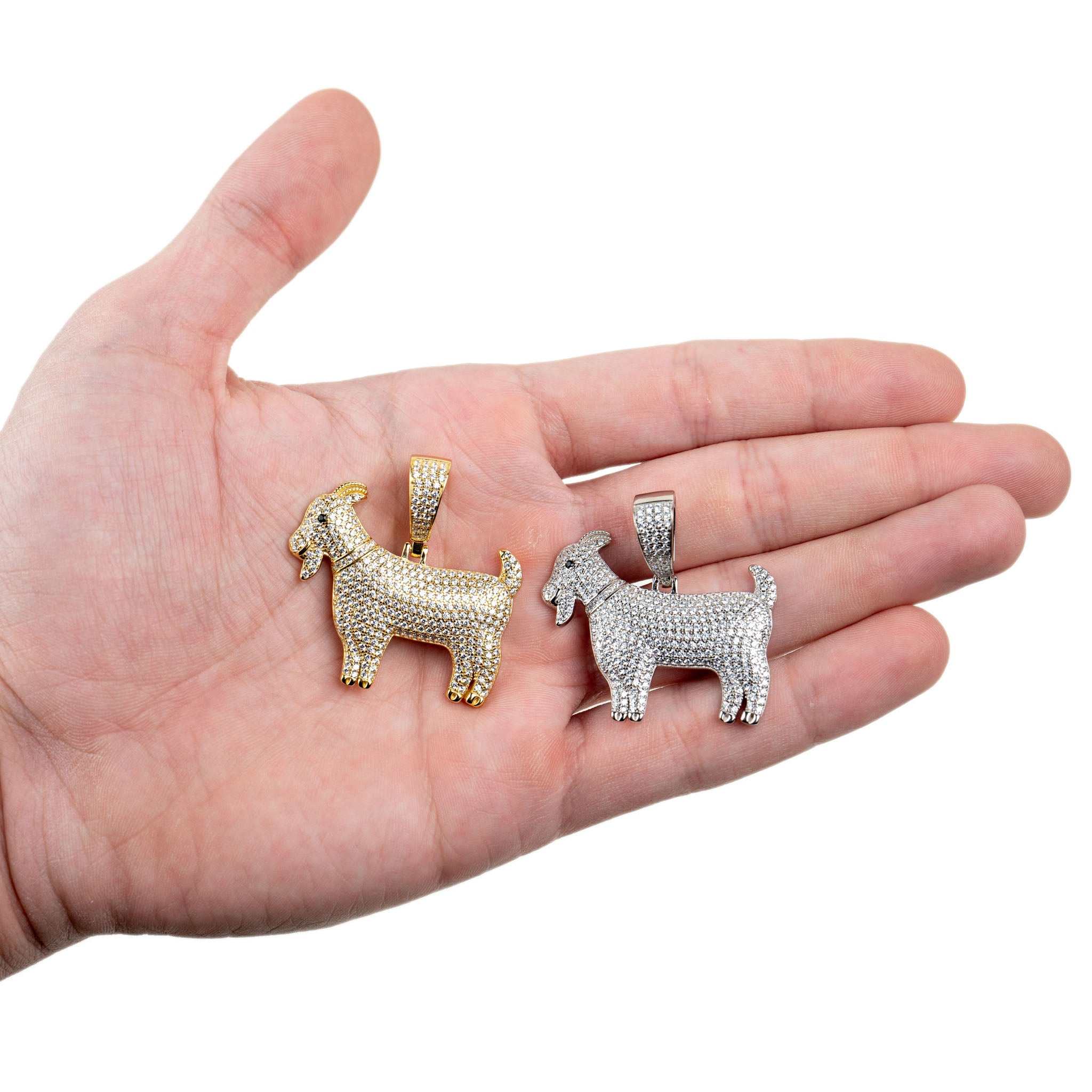GOAT Pendant in rhodium-plated silver and 14K gold on hand.