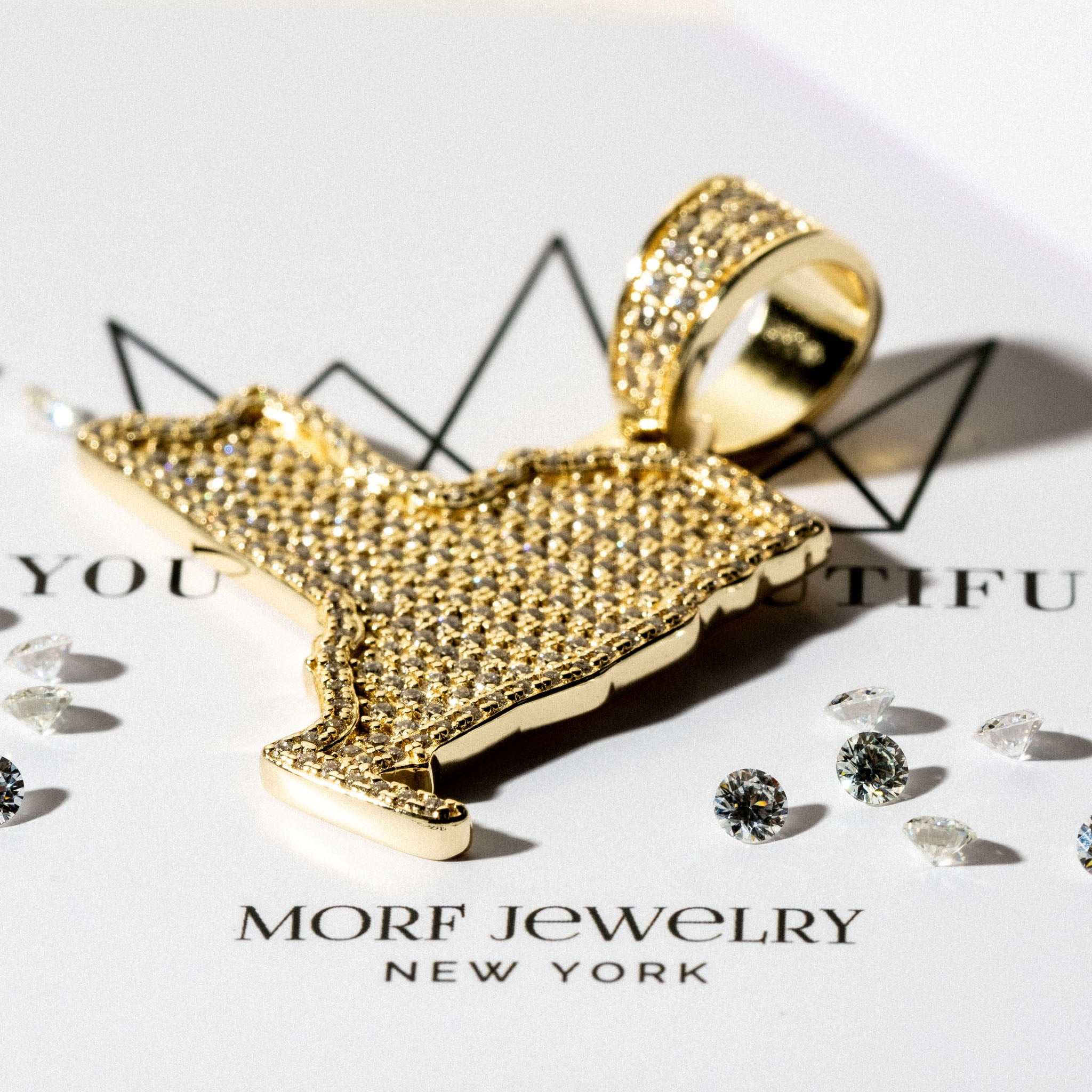 Gold New York pendant with micro paved cubic zirconia, crafted from 925 sterling silver.