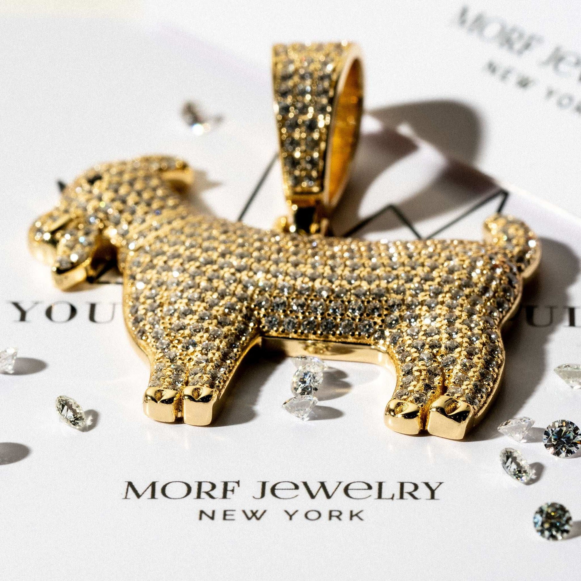 GOAT Pendant in 14K Gold over Sterling Silver on display.