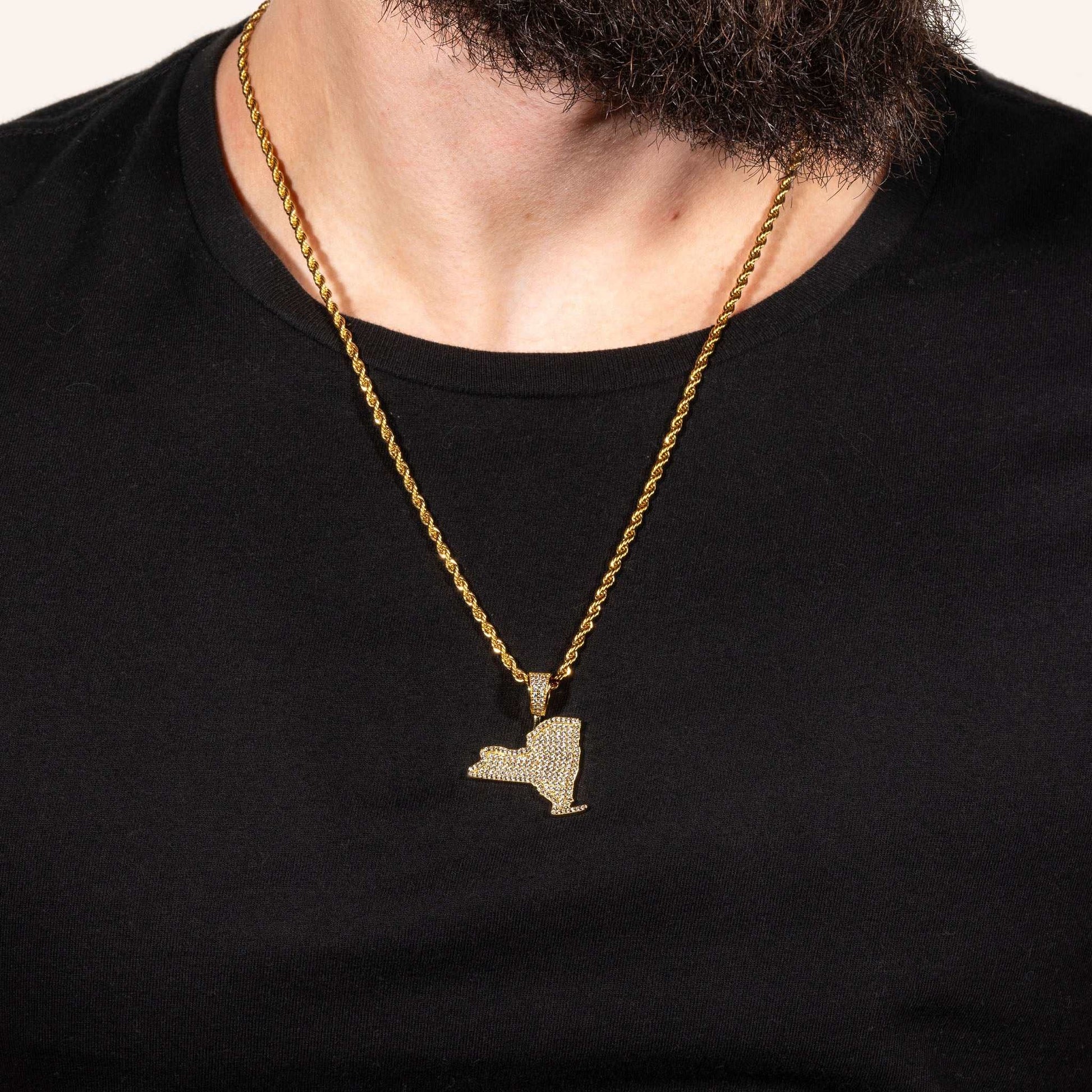 York Pendant made of solid 925 sterling silver with micro paved CZ diamonds, shown on a chain against a black background.