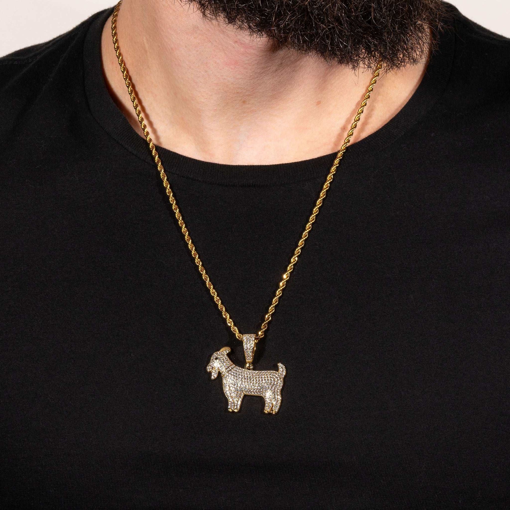 GOAT Pendant in sterling silver with rhodium or 14K gold plating worn on black shirt.