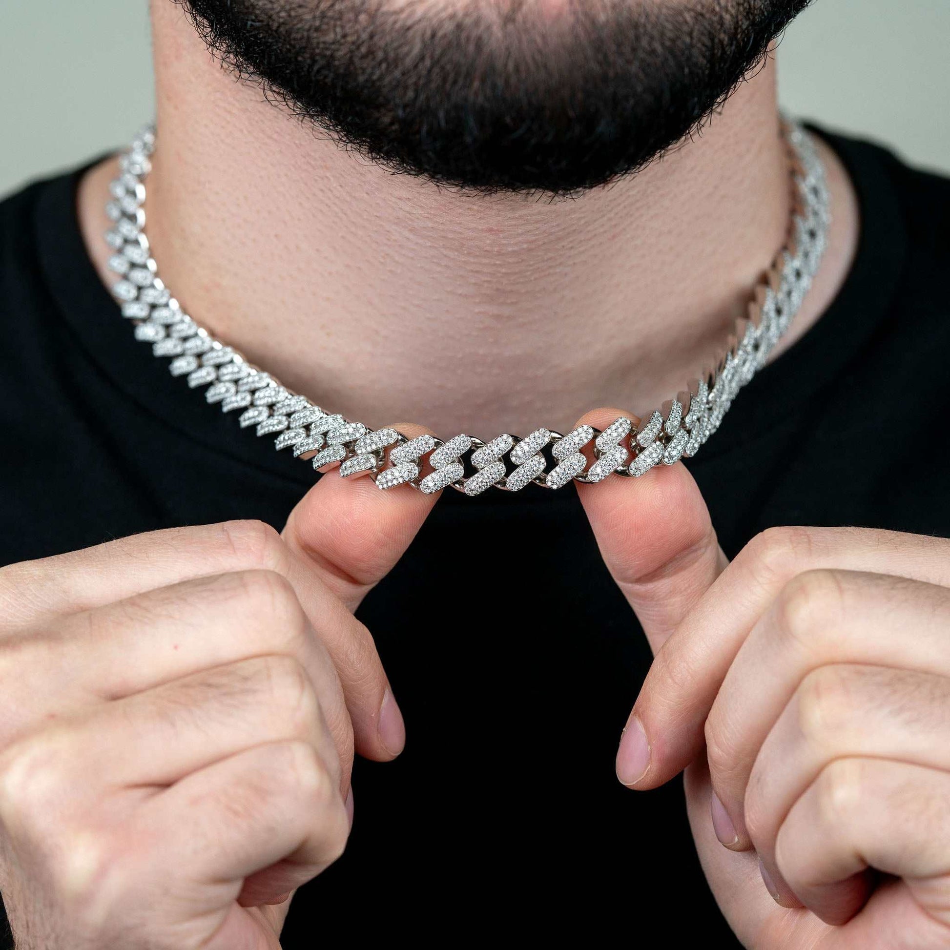 12mm Moissanite Miami Cuban Link Chain on model's neck, 925 Sterling Silver, 12MM thickness.