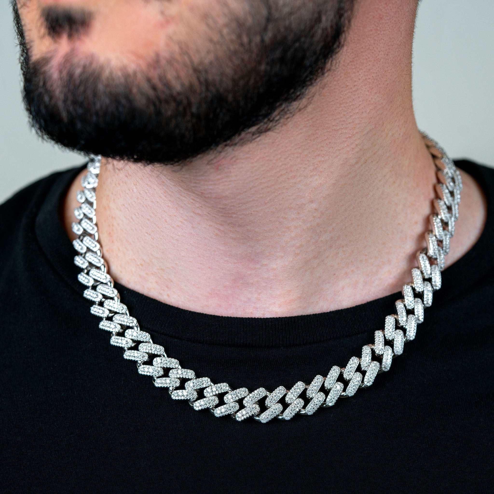 13mm men's moissanite Miami Cuban link chain in sterling silver with rhodium finish.