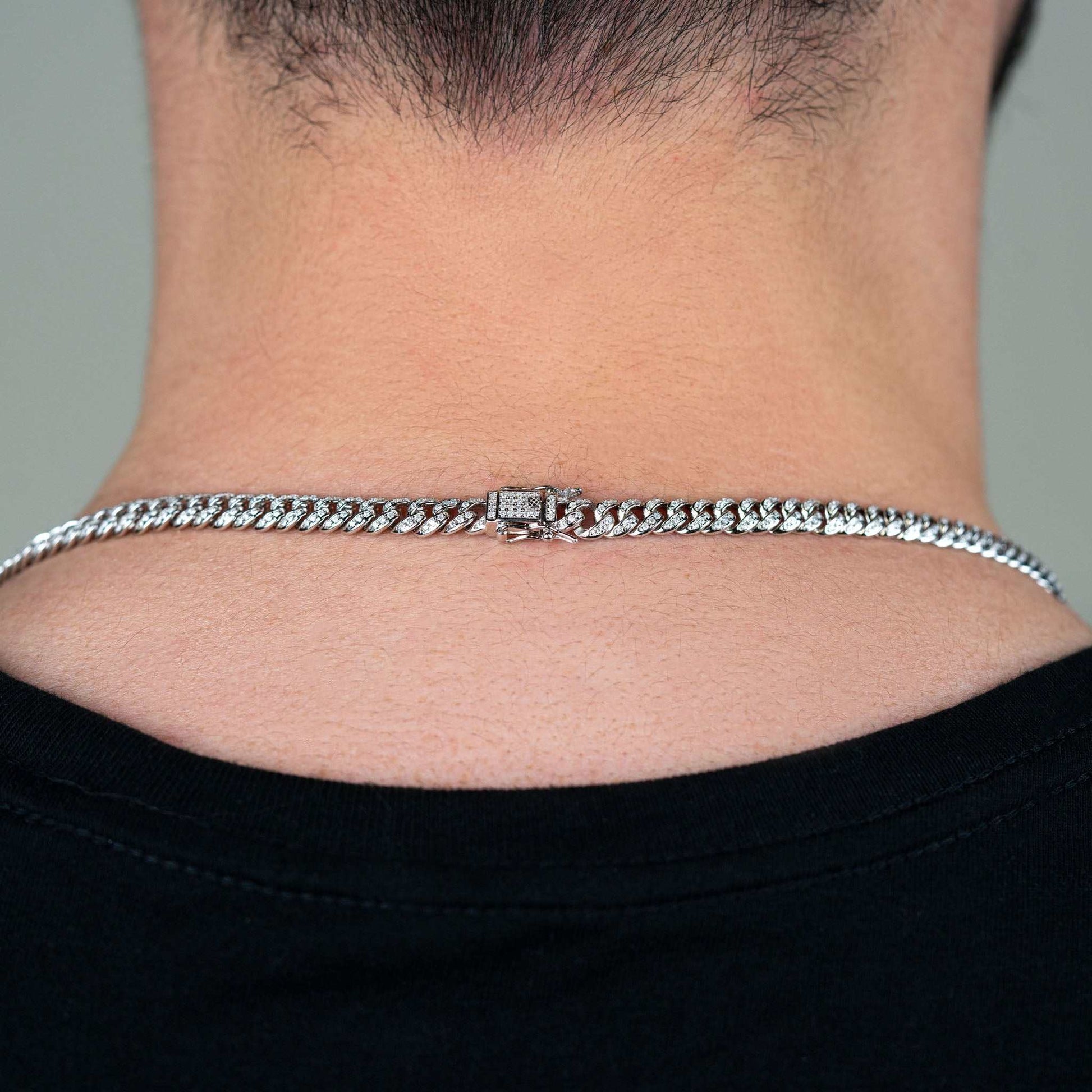 6MM Iced Moissanite Miami Link Chain on neck, unisex Cuban link design, solid 925 sterling silver.