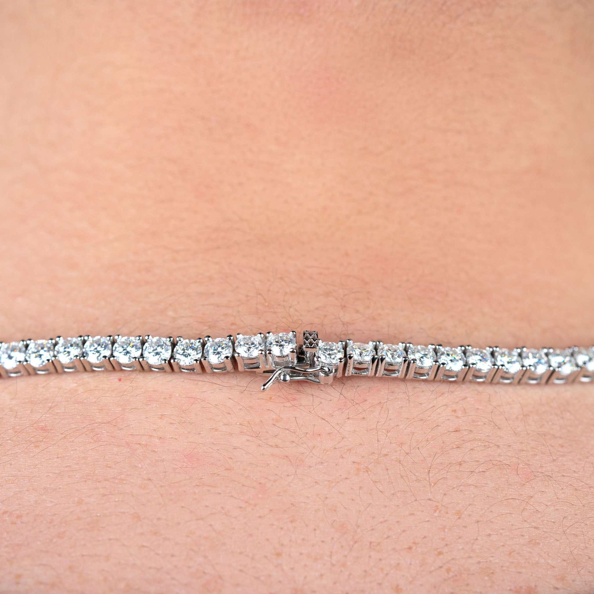 4mm Moissanite Tennis Chain on neck, 925 Sterling Silver, 20-inch length, 37.49ct D color VVS1 stones.