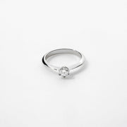 Moissanite Solitaire Engagement Ring in 925 Sterling Silver, six-prong round cut.