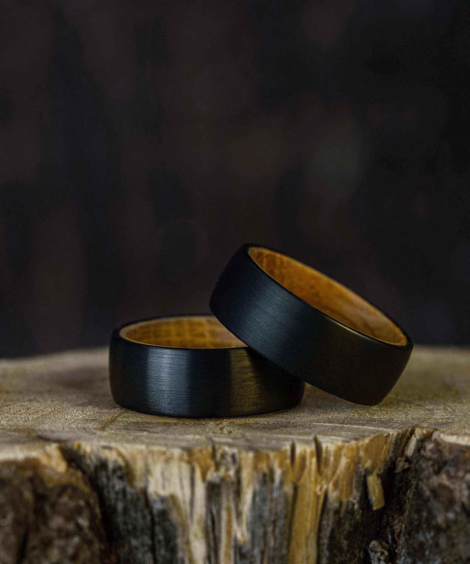 Black tungsten ring with etched outer band and olive wood inner band, Plain Whiskey Barrel Ring.