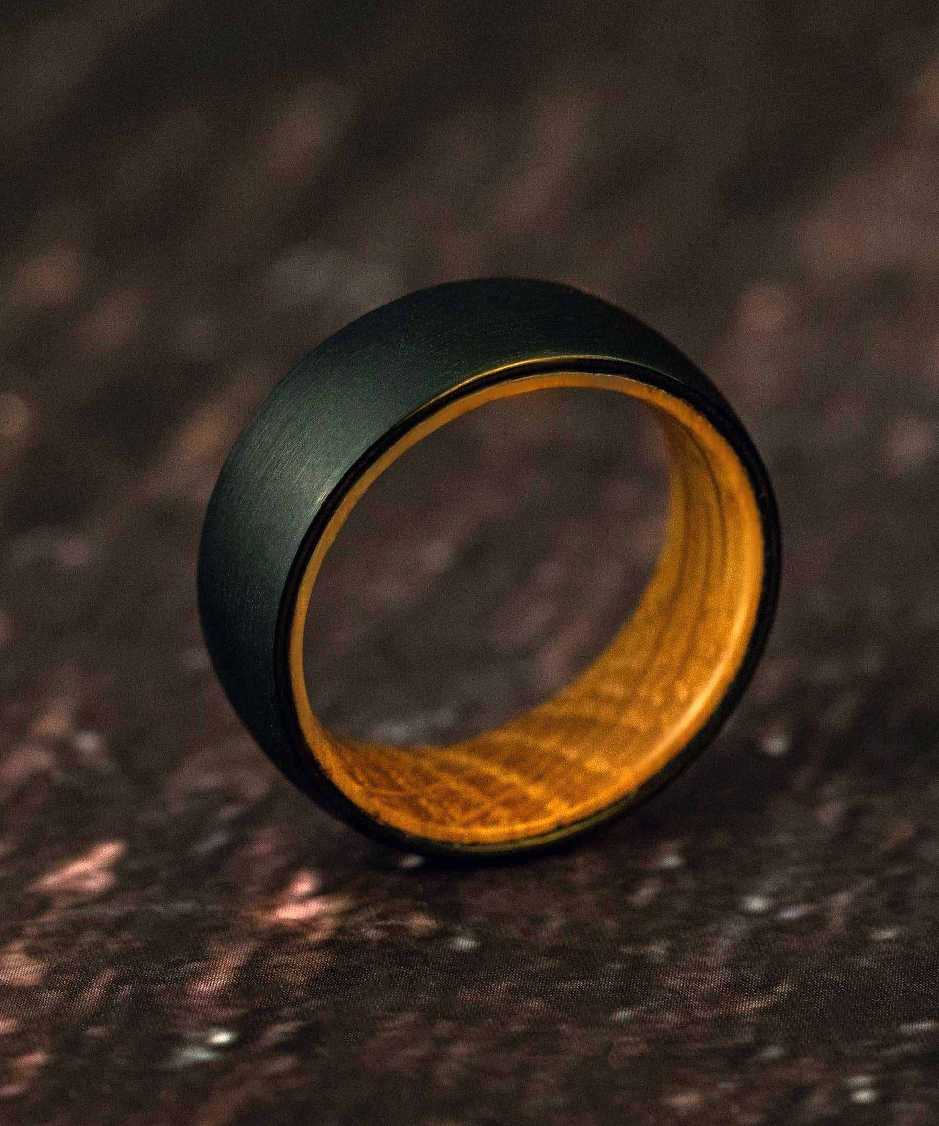 Unisex Plain Whiskey Barrel Ring with black satin tungsten exterior and olive wood interior.