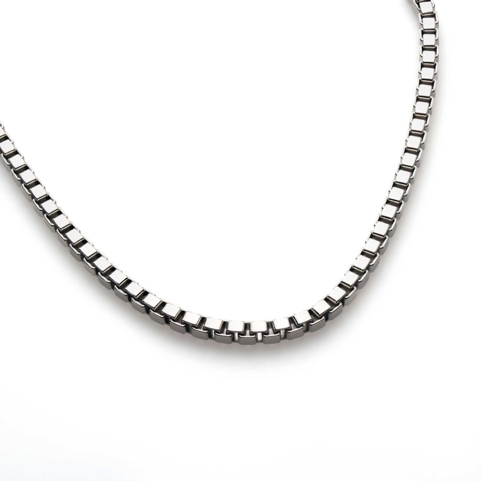 Sterling silver box chain necklace with squared links and lobster claw closure.