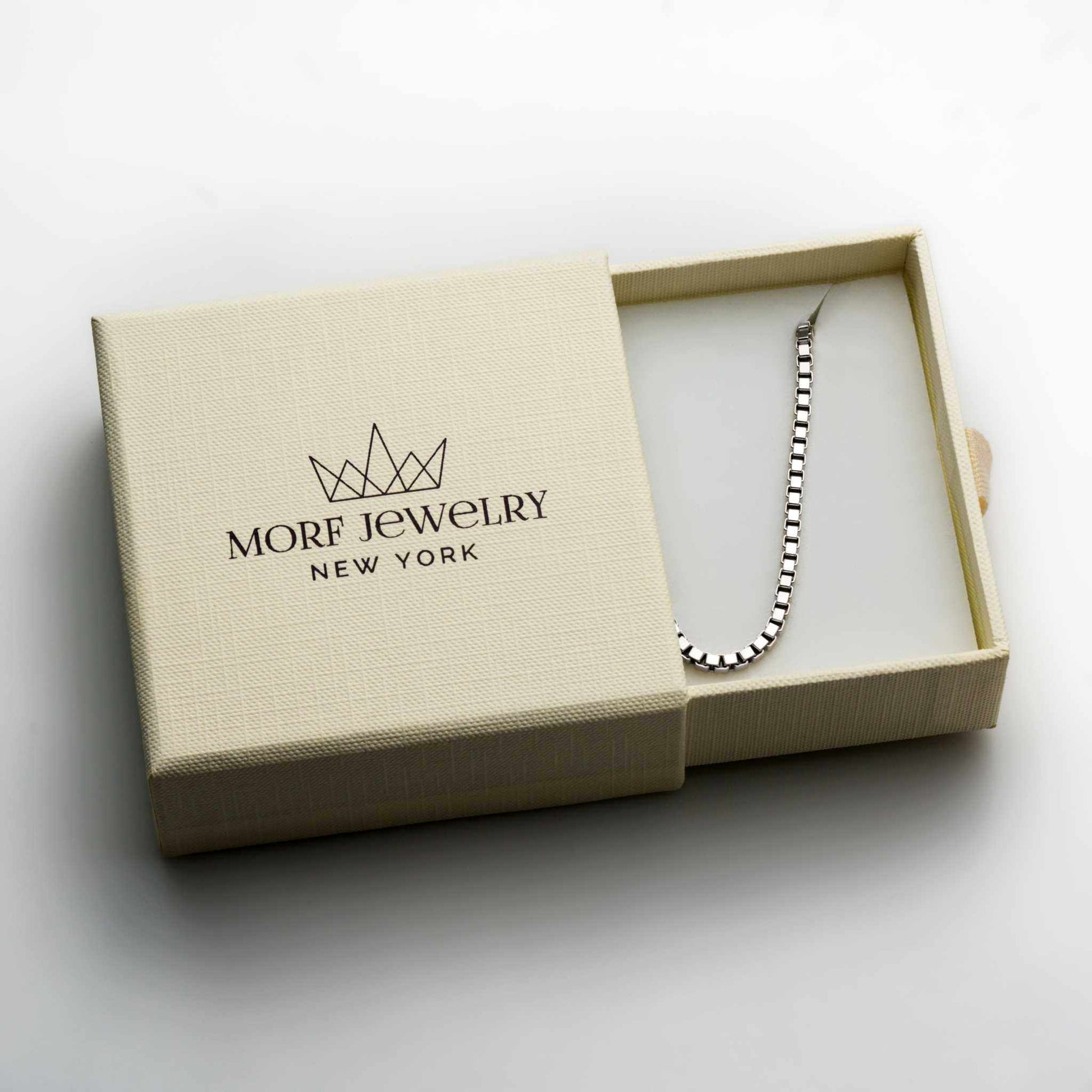 Sterling silver box chain necklace in jewelry box.