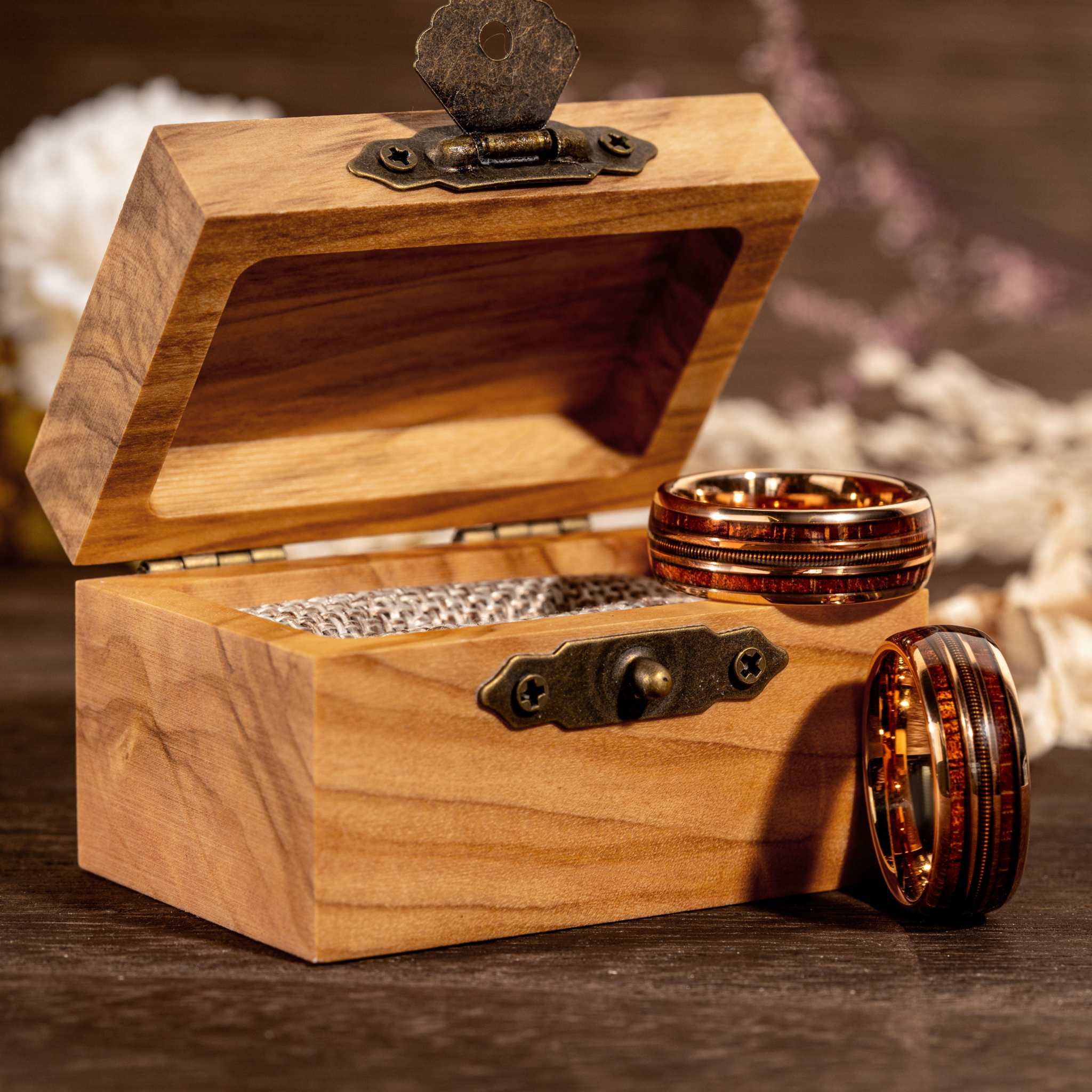 Guitar String Whiskey Barrel Ring in rose gold and tungsten with olive wood box.