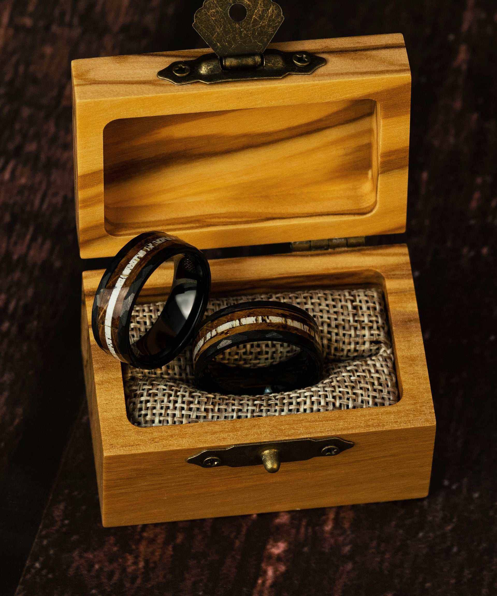 Hammered Antler Ring in tungsten displayed in a wooden box, unisex design.