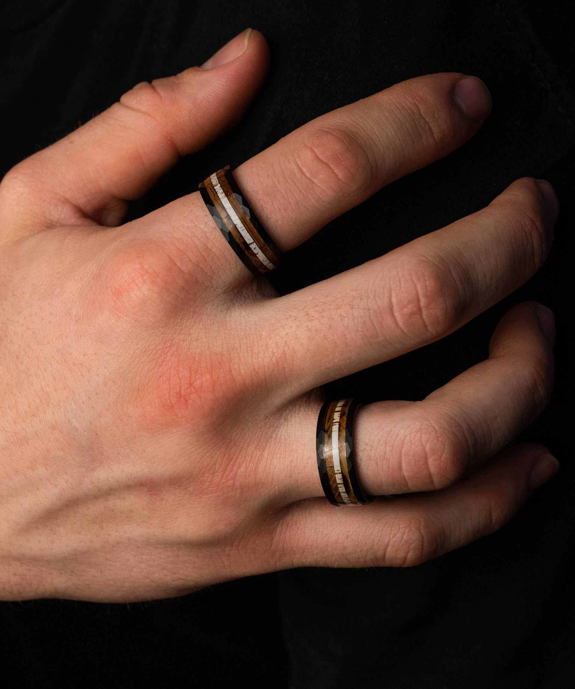 Hammered Antler Ring in tungsten on hand, unisex jewelry.