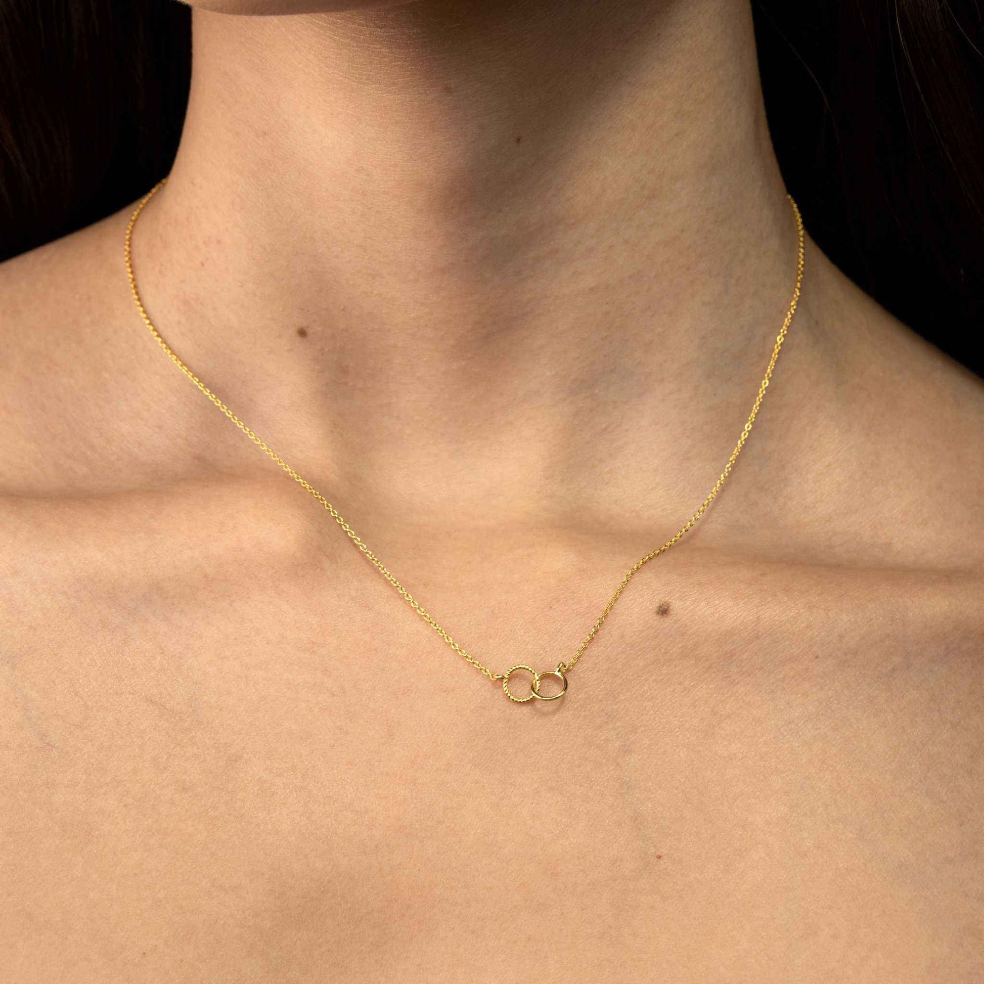 Interlocking Circle Necklace in gold-plated sterling silver on a dainty chain.