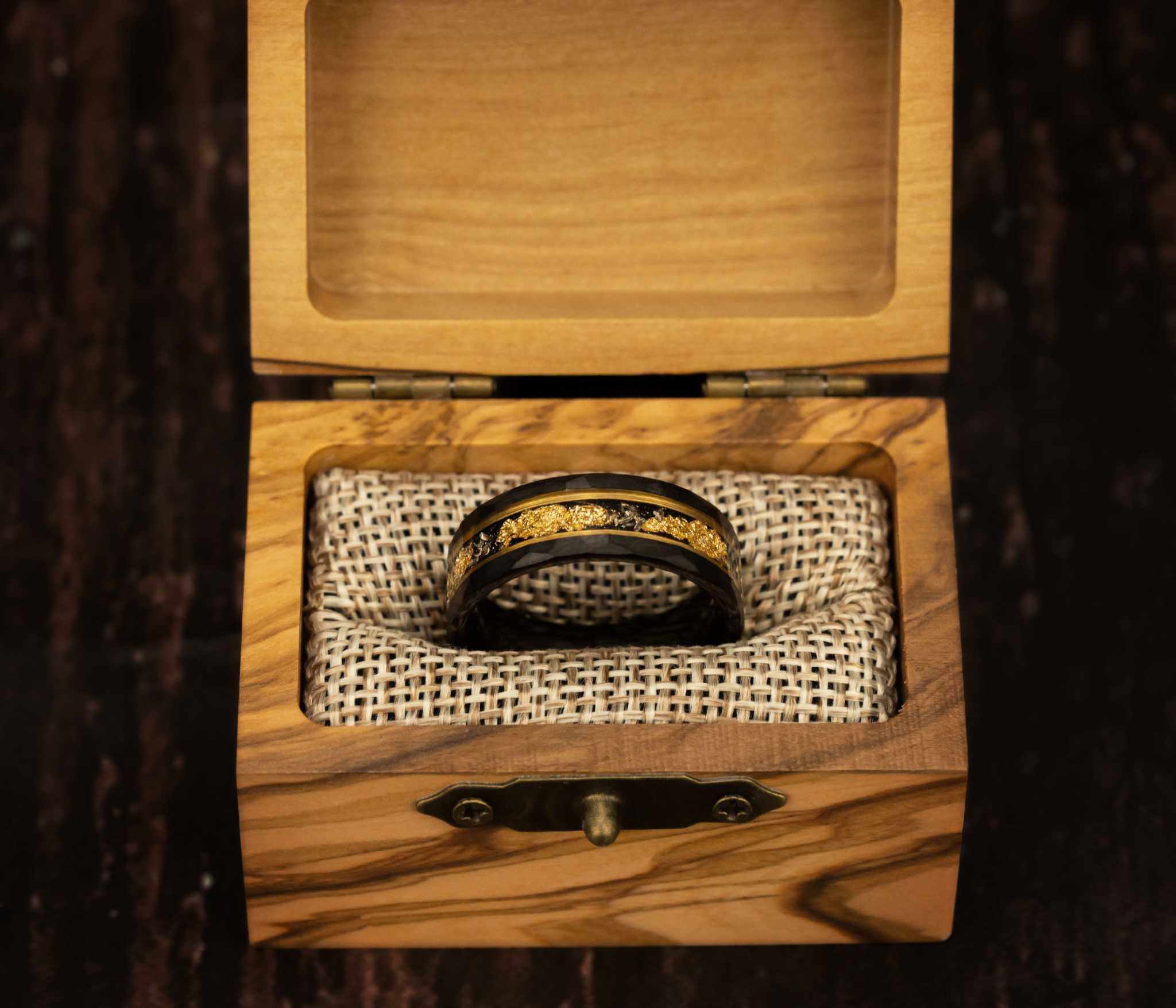 Gold Leaf Meteorite Ring in wooden box, showcasing its tungsten, meteorite, and 22K gold leaf design.
