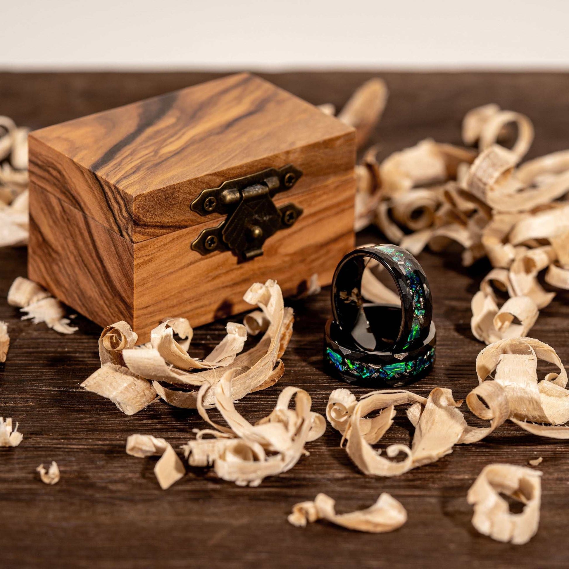 Meteorite & Green Opal Ring on display with wooden box and shavings