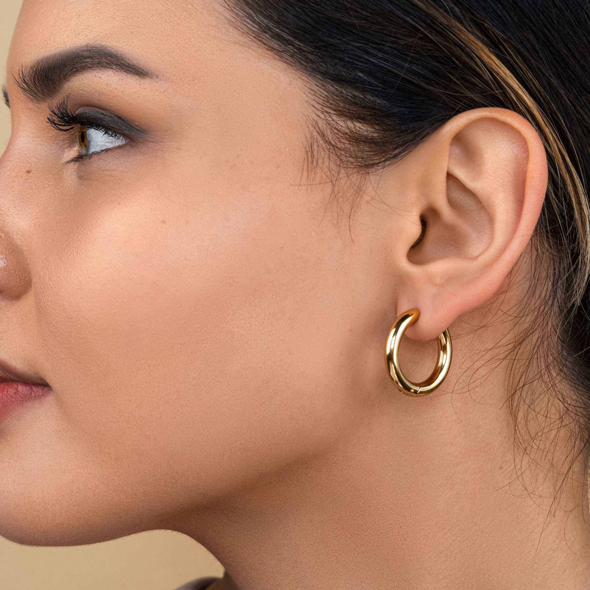 18k gold plated stainless steel Mirage Bold Hoops on ear
