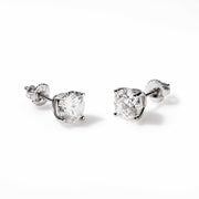 Pair of round cut moissanite stud earrings in 925 sterling silver with screw back closure and 14K white gold plating.